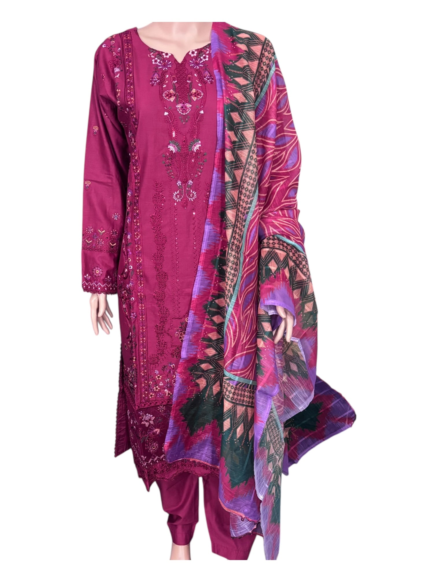 Traditional Pakistani Salwar Kameez by Saree Ghor Charlotte, elegant ethnic wear for women with colorful fabric and intricate embroidery.