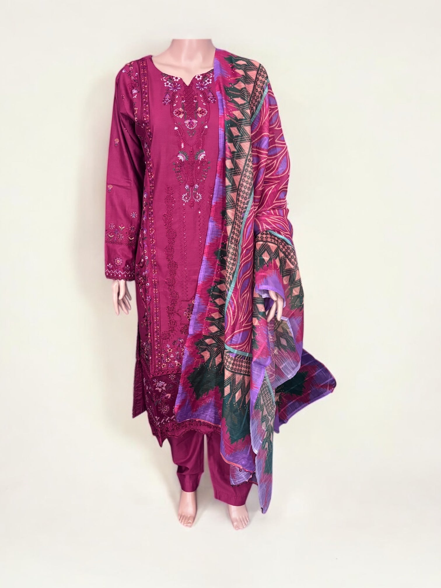 Traditional Pakistani Salwar Kameez by Saree Ghor Charlotte, vibrant ethnic wear for women with intricate design and colorful fabric.
