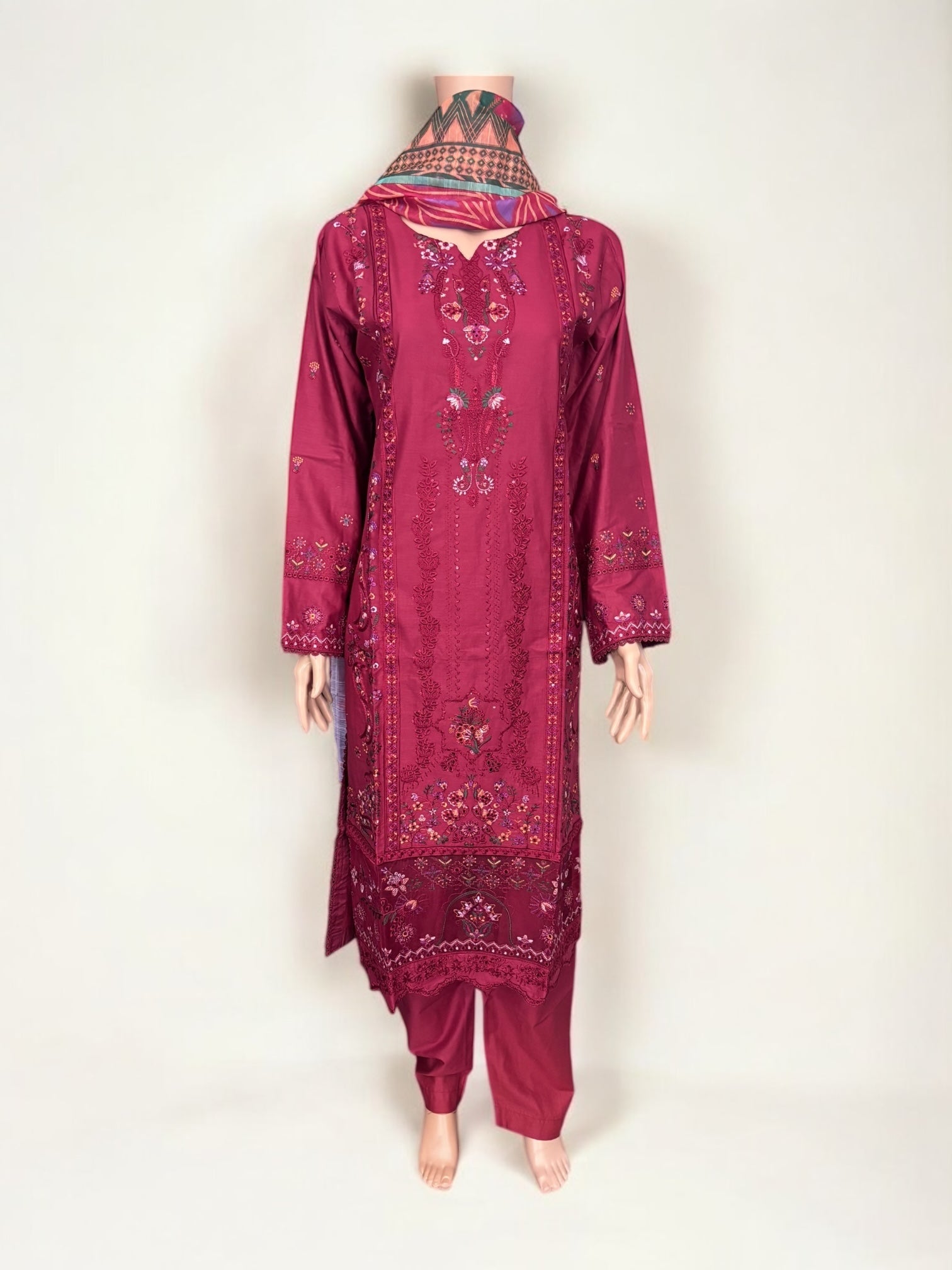 Traditional Pakistani Salwar Kameez by Saree Ghor Charlotte, showcasing intricate embroidery and vibrant ethnic wear for women.