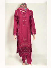 Traditional Pakistani Salwar Kameez by Saree Ghor Charlotte showing intricate embroidery and vibrant fabric for women’s ethnic wear.