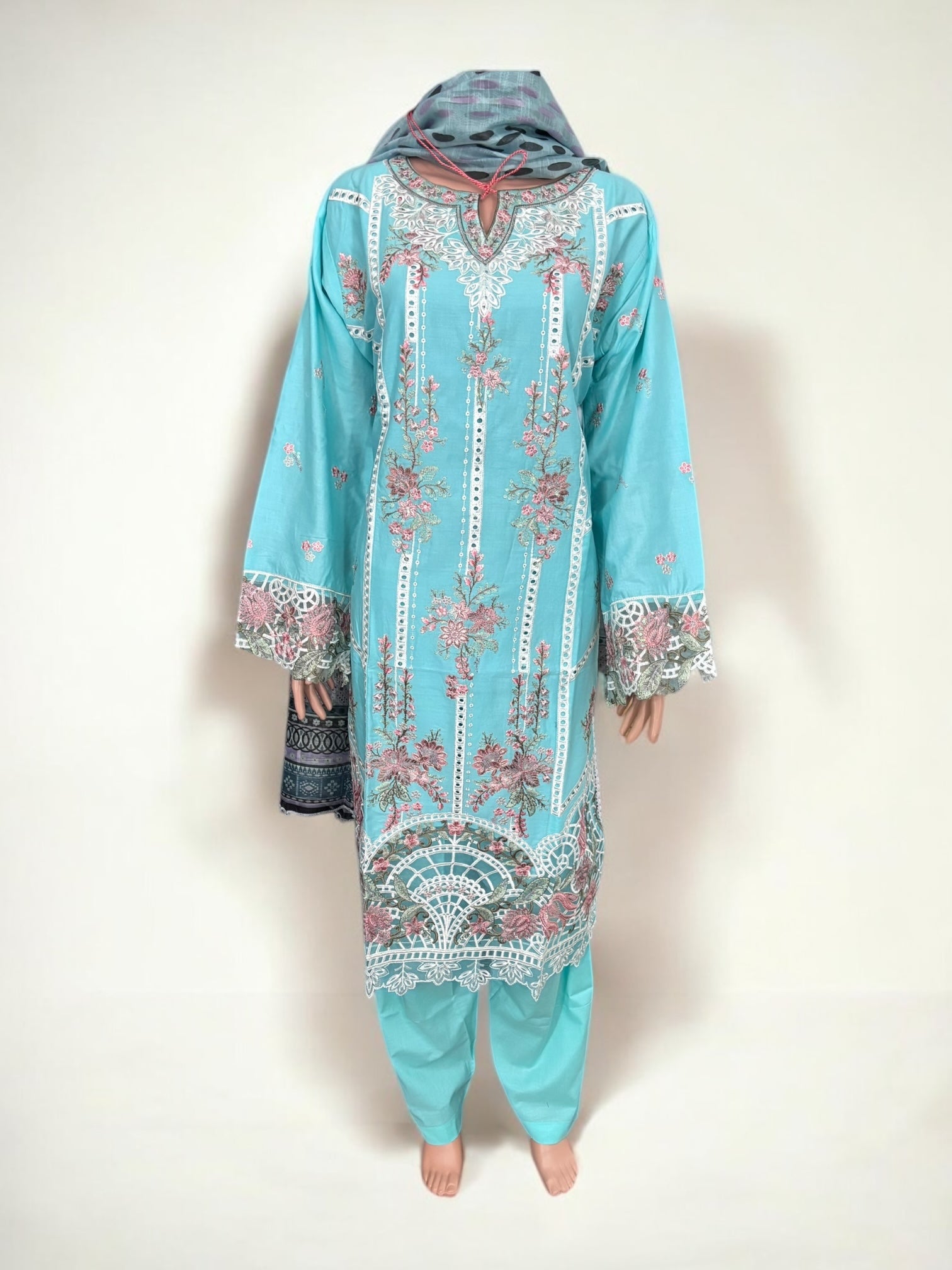 Traditional Pakistani Salwar Kameez by Saree Ghor Charlotte featuring vibrant ethnic wear for women with intricate embroidery.