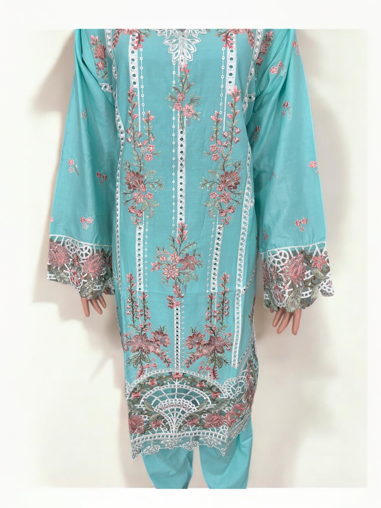 Traditional Pakistani Salwar Kameez by Saree Ghor Charlotte, vibrant ethnic wear for women with intricate patterns and flowing fabric.
