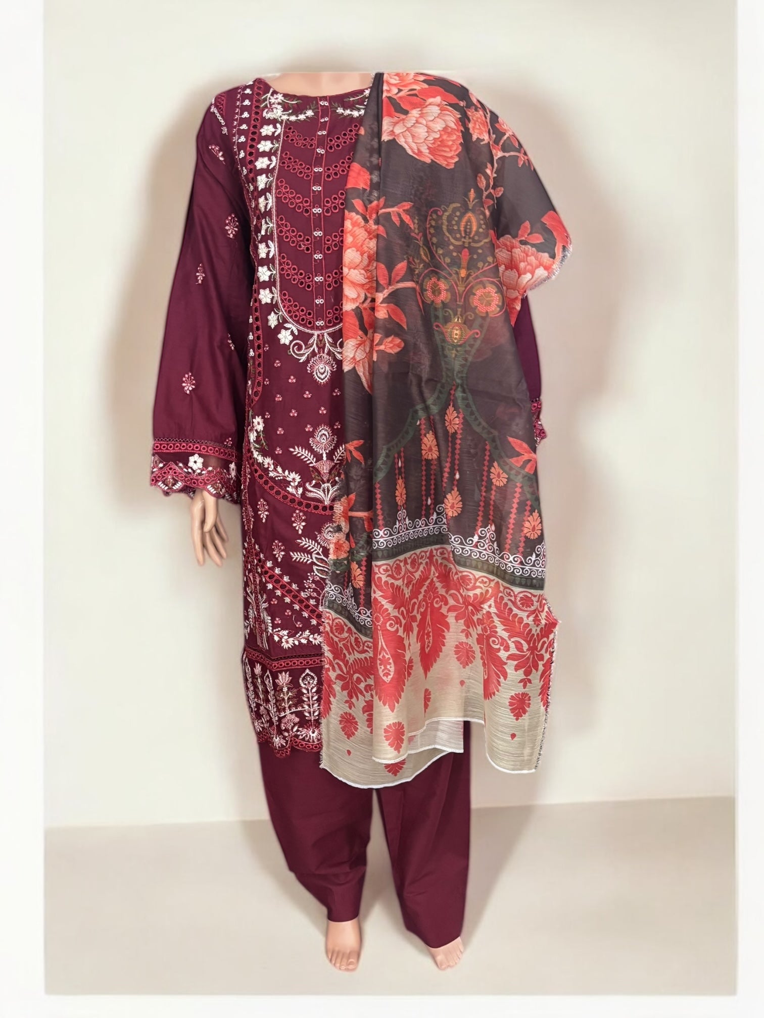 Traditional Pakistani Salwar Kameez by Saree Ghor Charlotte, elegant ethnic wear for women with intricate embroidery and vibrant colors.