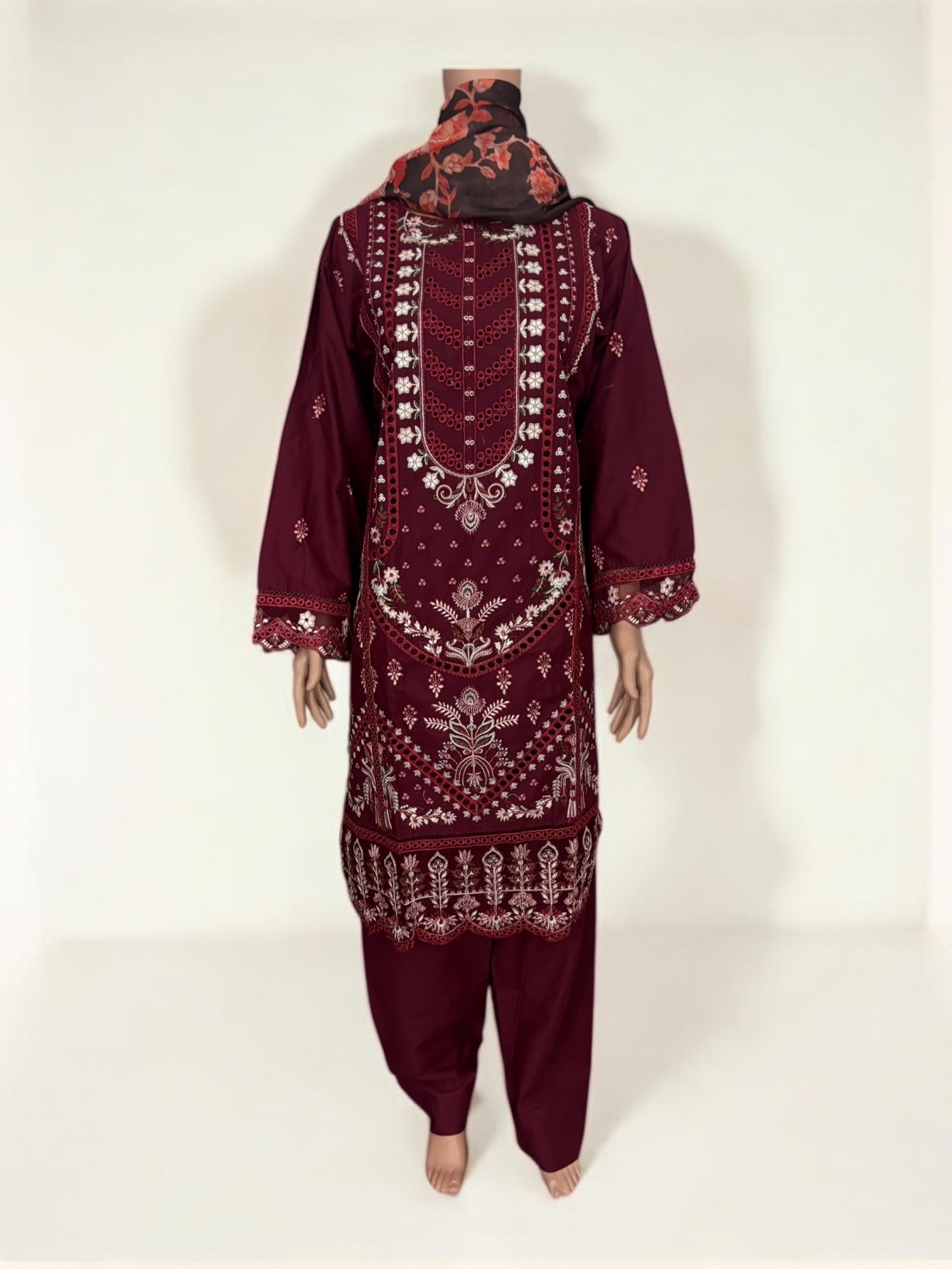 Traditional Pakistani Salwar Kameez by Saree Ghor Charlotte, ethnic wear for women with intricate embroidery and vibrant fabric.