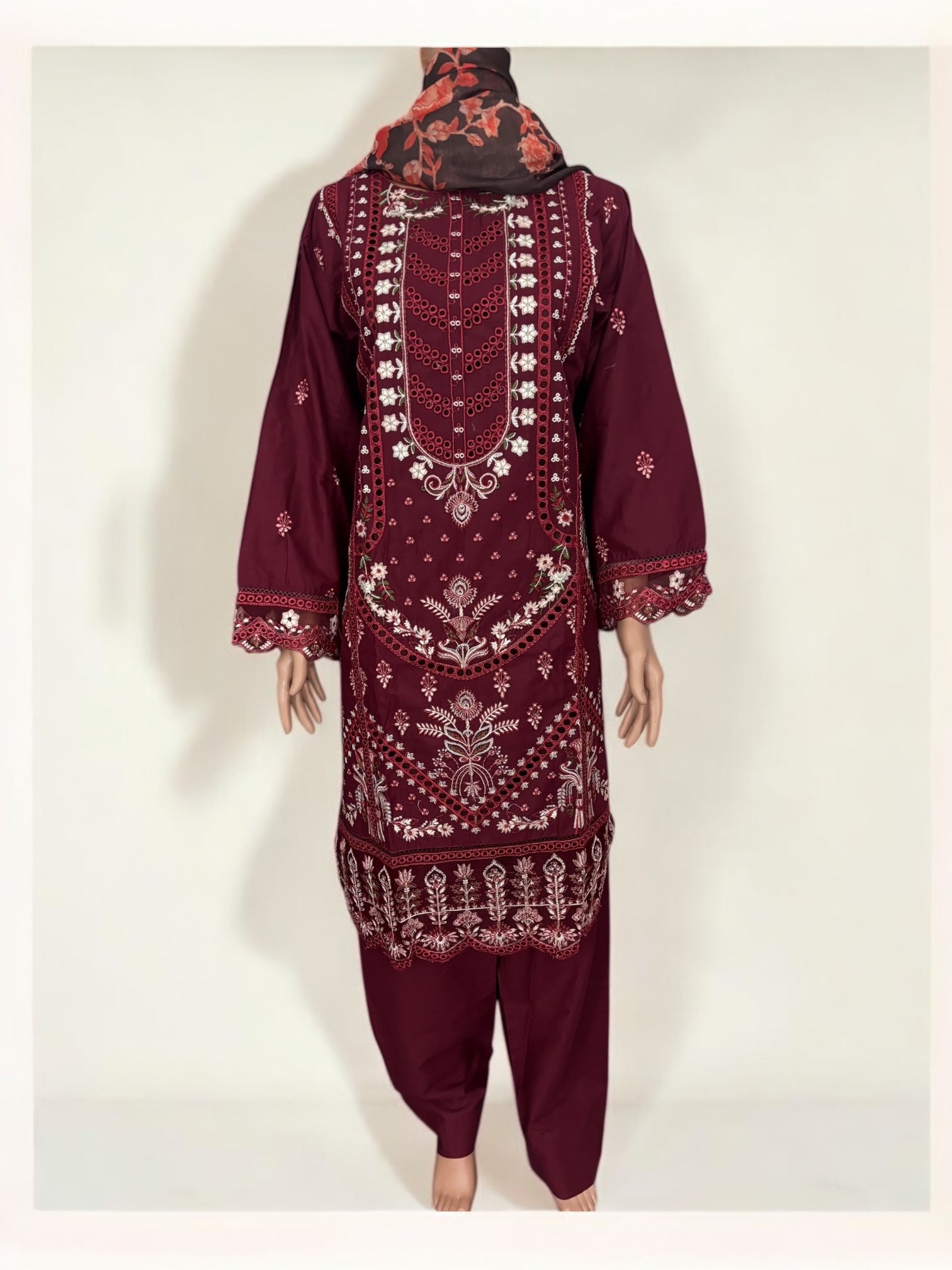 Traditional Pakistani Salwar Kameez by Saree Ghor Charlotte, women's ethnic wear with intricate patterns and vibrant colors.