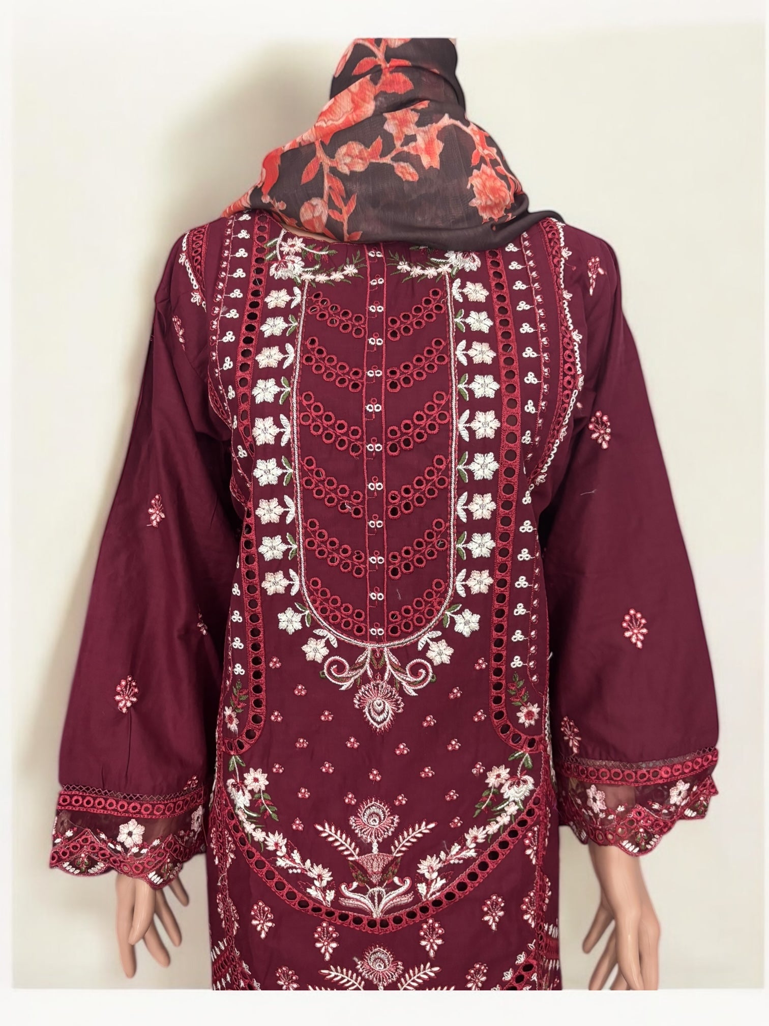 Traditional Pakistani Salwar Kameez by Saree Ghor Charlotte, vibrant ethnic wear for women in a detailed fabric design.