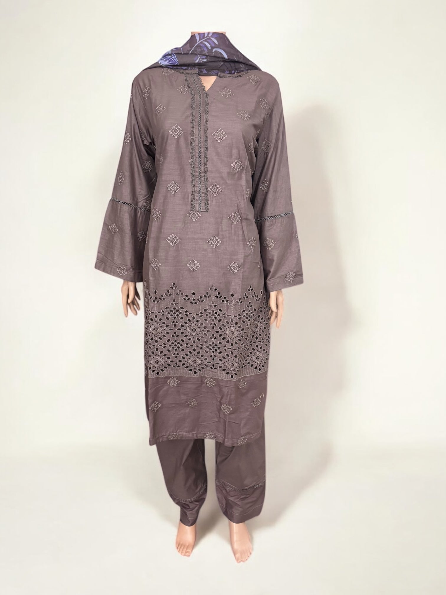 Traditional Pakistani Salwar Kameez by Saree Ghor Charlotte, showcasing intricate ethnic wear for women with vibrant fabric and detailed embroidery.