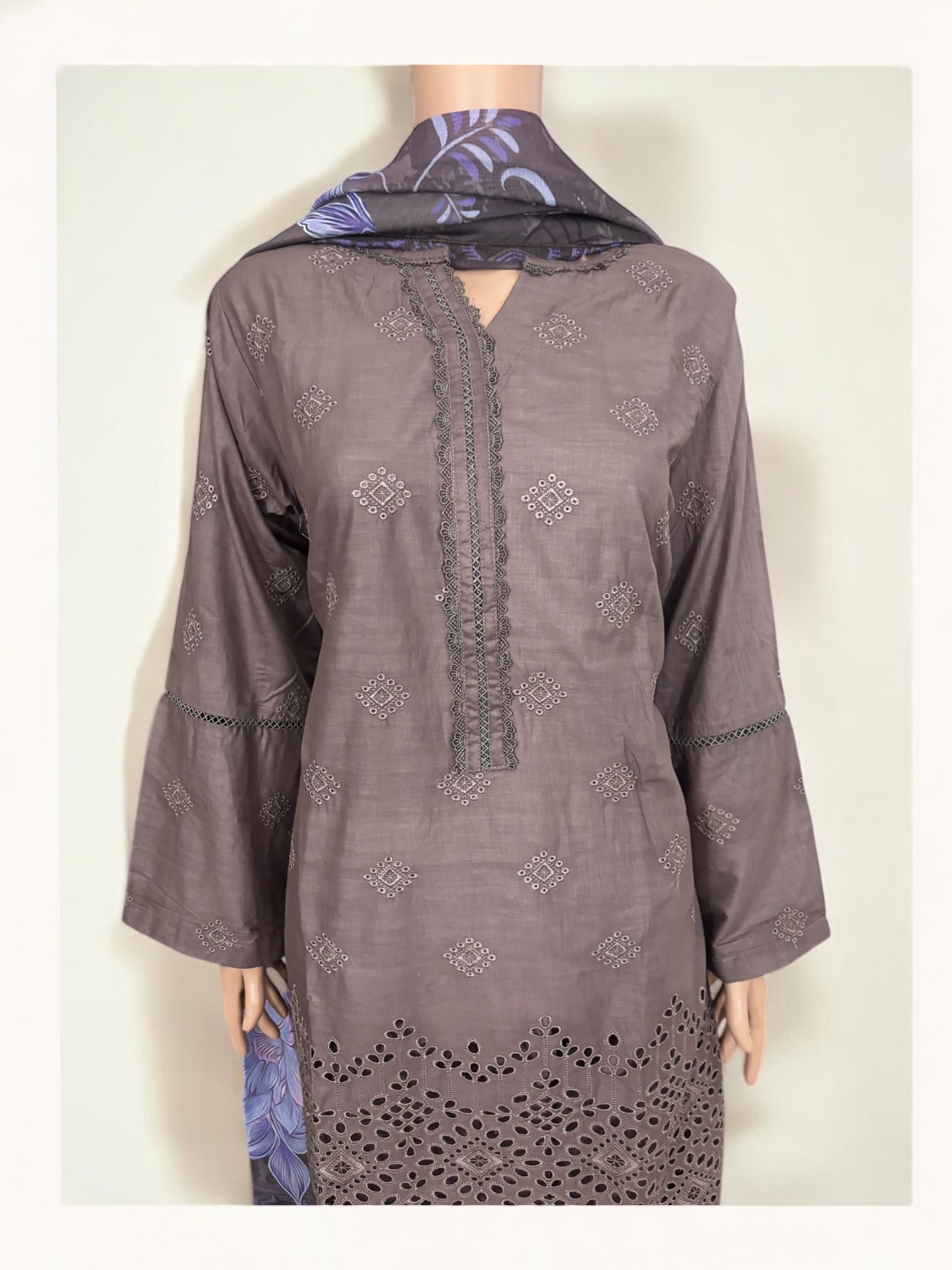 Traditional Pakistani Salwar Kameez by Saree Ghor Charlotte, featuring vibrant ethnic wear for women with intricate embroidery and colorful fabric.