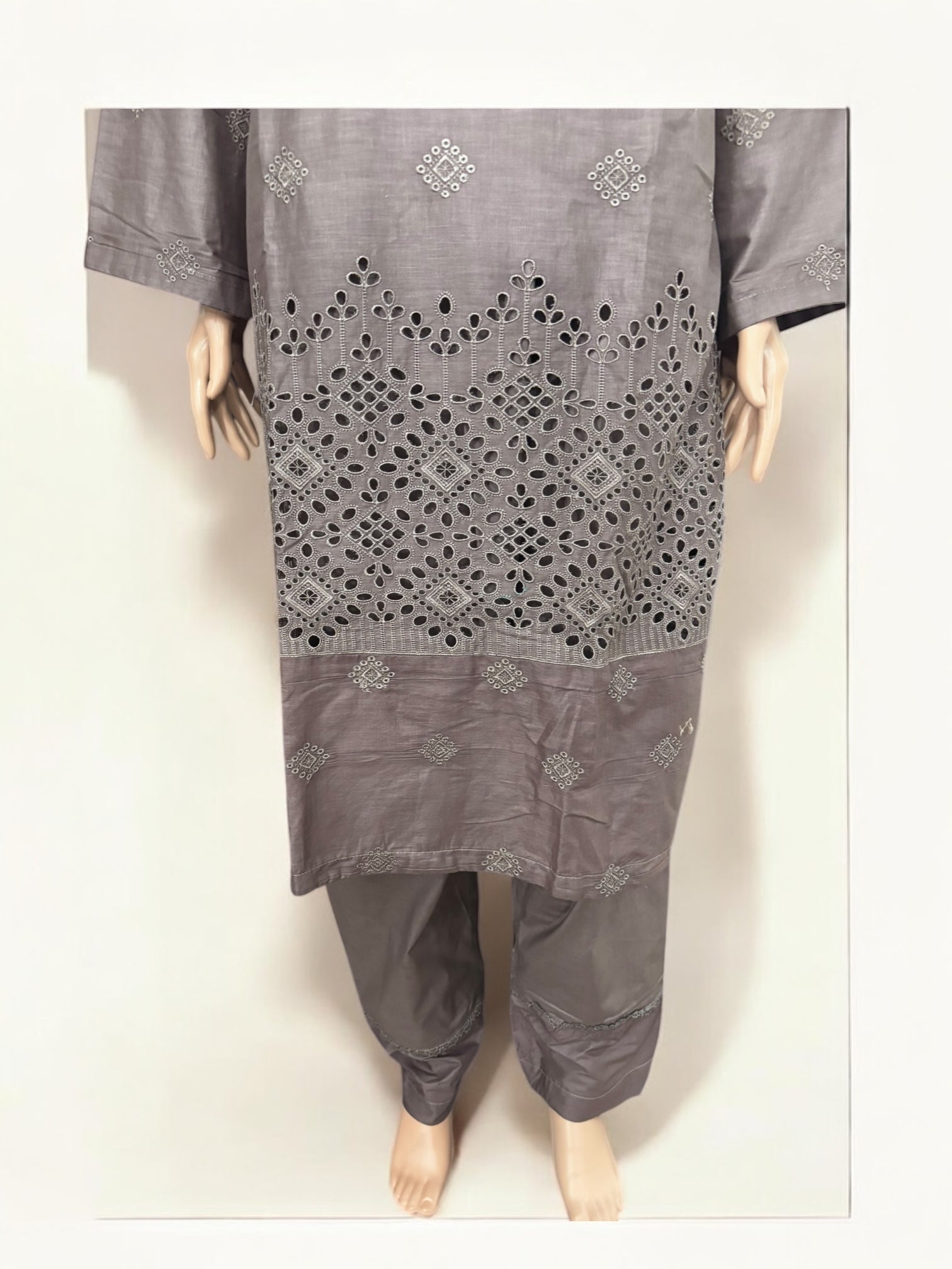 Traditional Pakistani Salwar Kameez by Saree Ghor Charlotte, featuring vibrant ethnic wear for women with intricate designs.