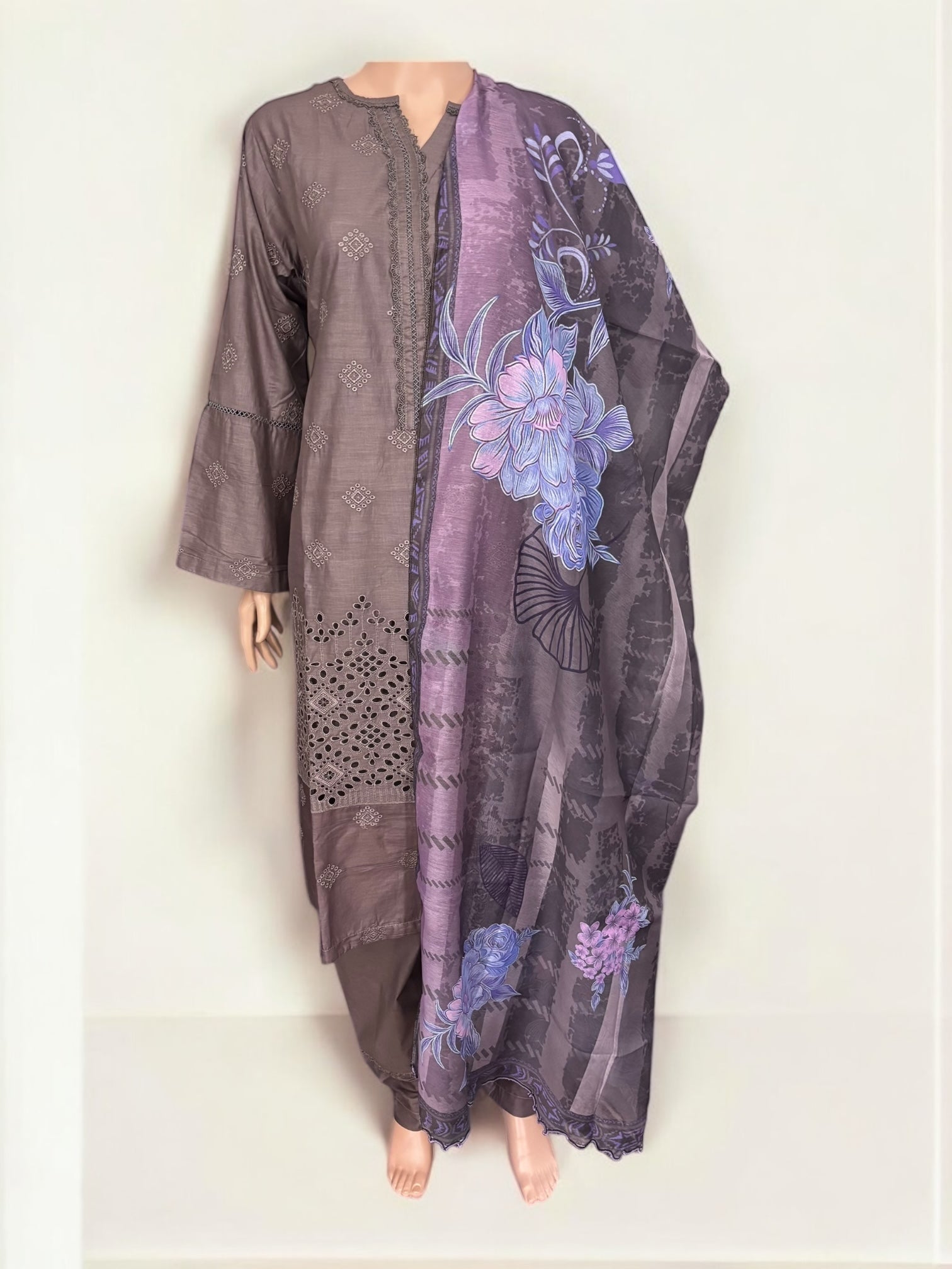 Traditional Pakistani Salwar Kameez by Saree Ghor Charlotte, featuring intricate ethnic fabric and vibrant design for women.