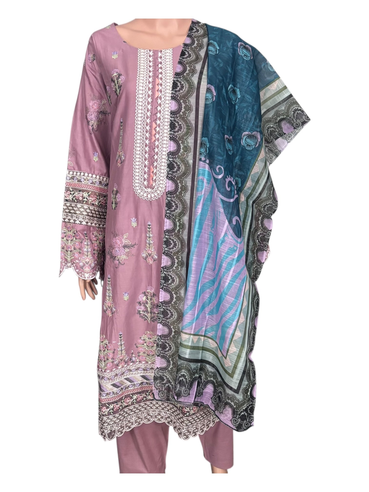 Traditional Pakistani Salwar Kameez by Saree Ghor Charlotte, women’s ethnic wear with intricate embroidery and vibrant fabric.