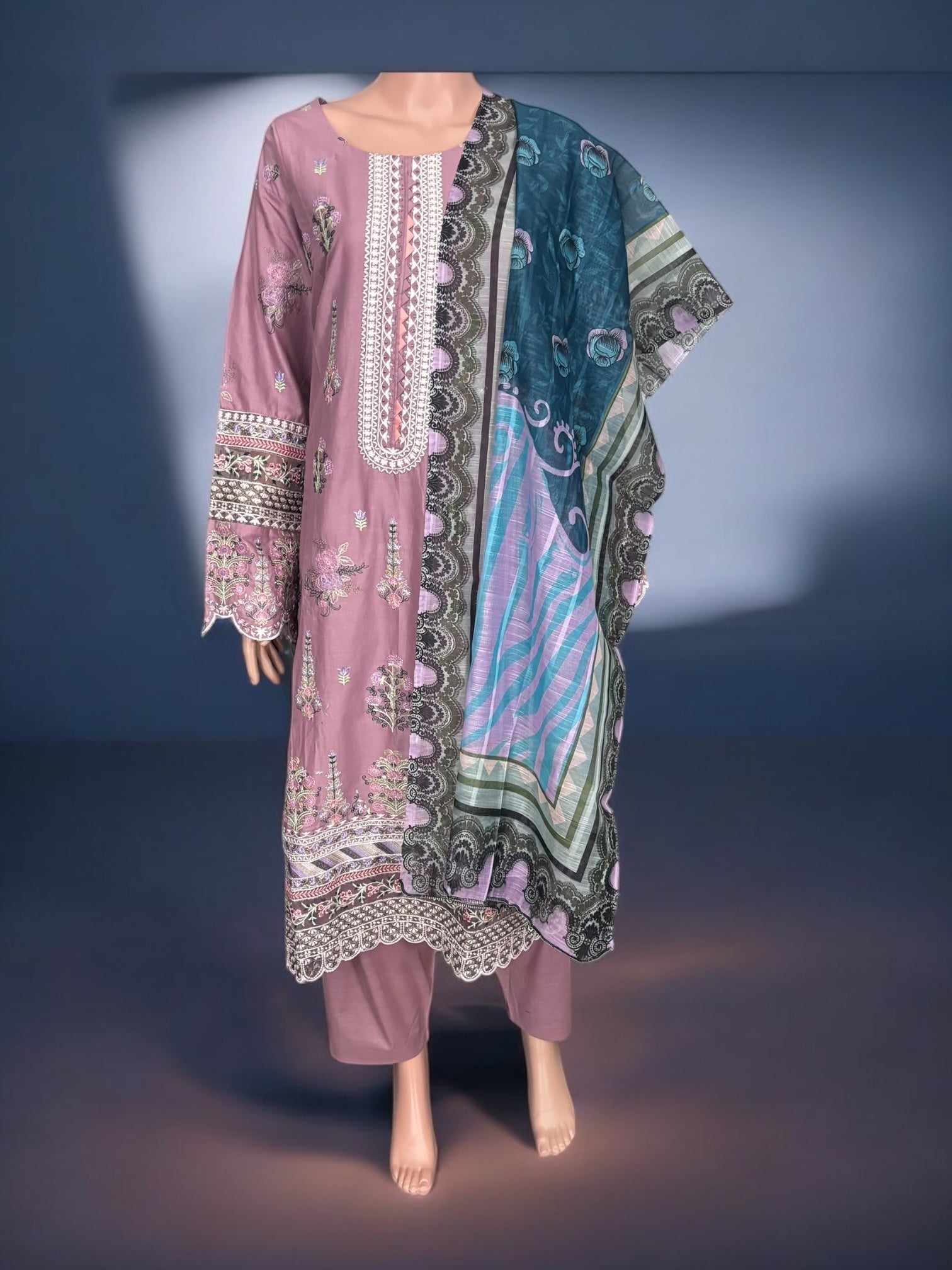 Traditional Pakistani Salwar Kameez by Saree Ghor Charlotte, showcasing vibrant ethnic wear with intricate embroidery for women.