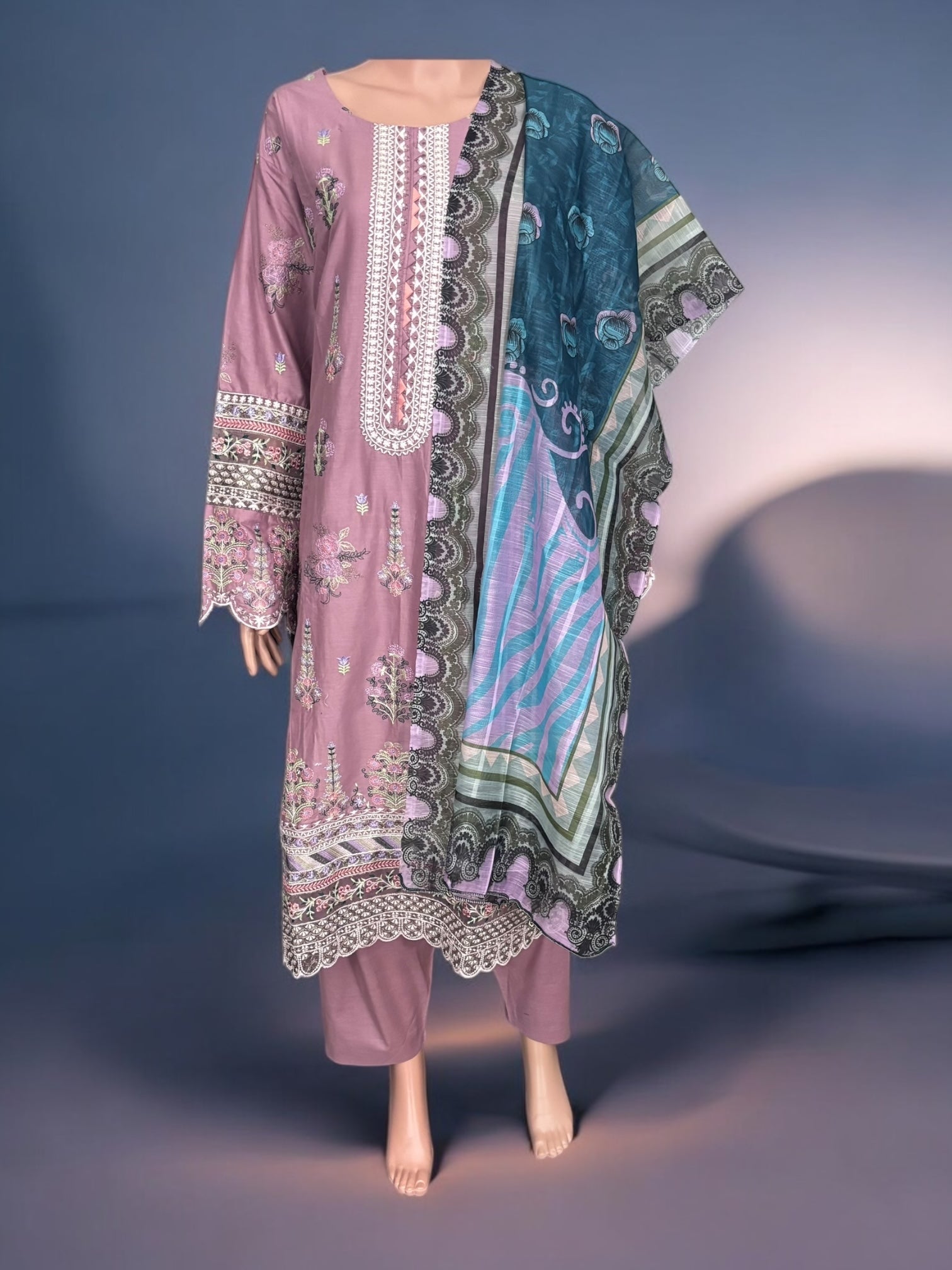 Traditional Pakistani Salwar Kameez by Saree Ghor Charlotte, featuring intricate ethnic embroidery and vibrant fabric for women.