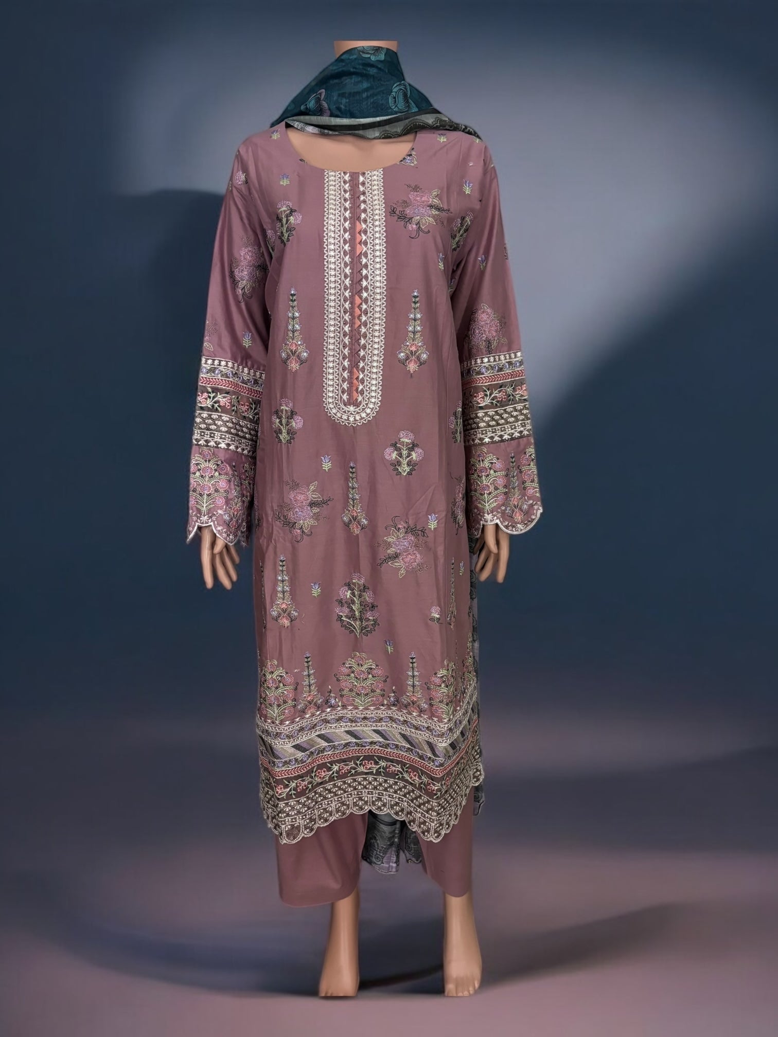 Traditional Pakistani Salwar Kameez by Saree Ghor Charlotte, featuring colorful ethnic wear for women with intricate embroidery.
