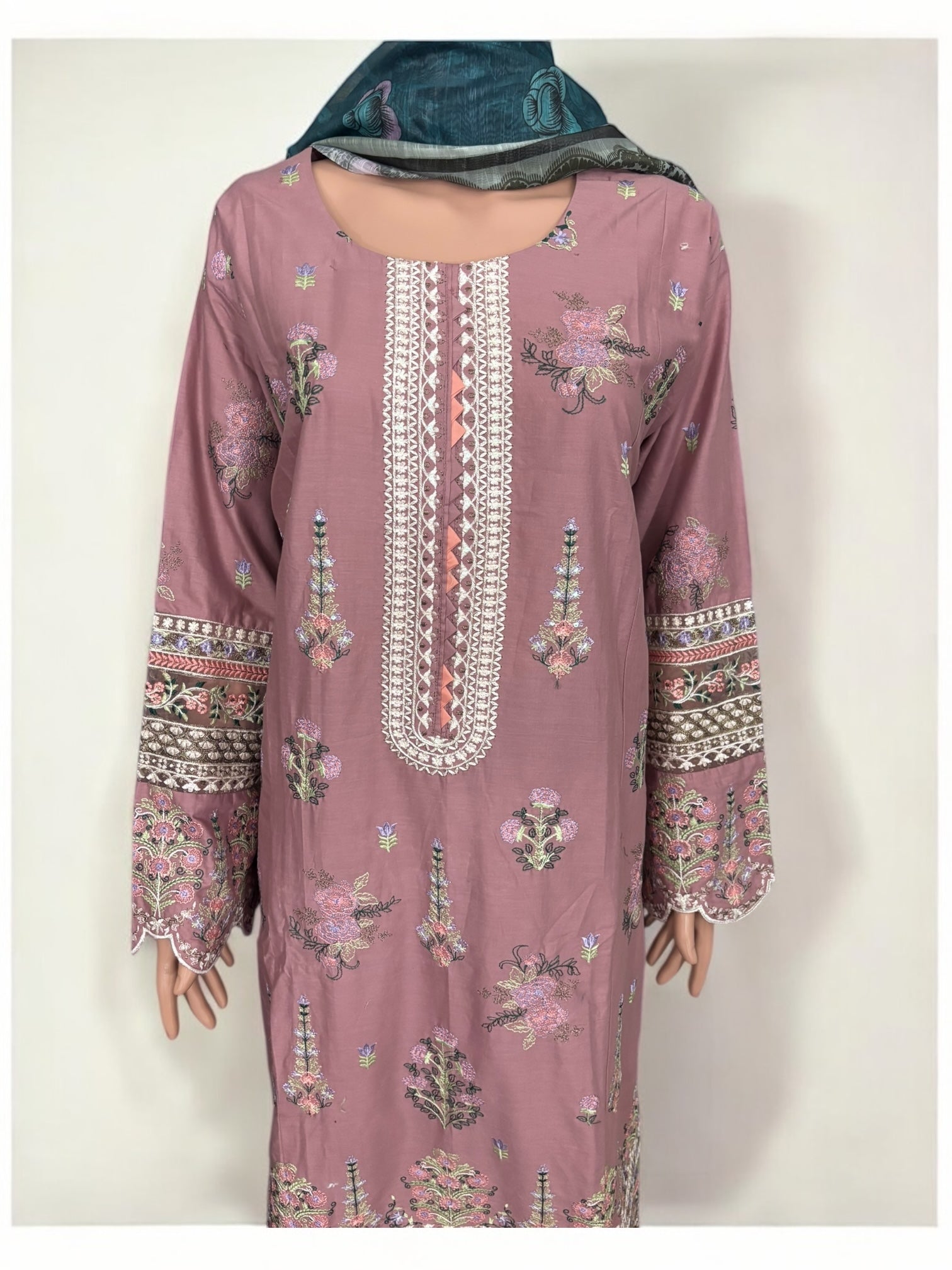 Traditional Pakistani Salwar Kameez by Saree Ghor Charlotte, showcasing intricate embroidery and vibrant ethnic wear for women.