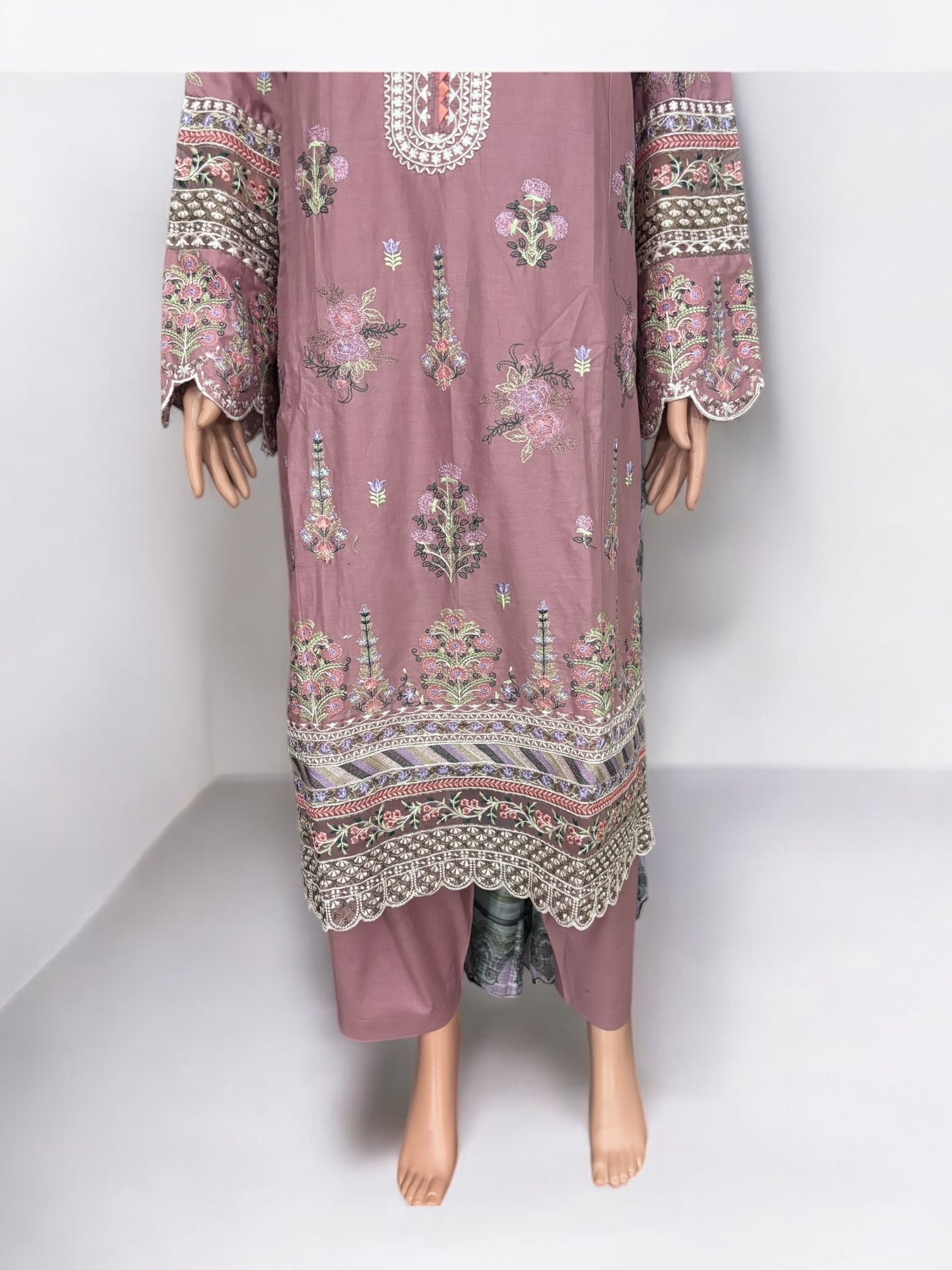 Traditional Pakistani Salwar Kameez by Saree Ghor Charlotte, vibrant ethnic wear for women with intricate embroidery and classic style.