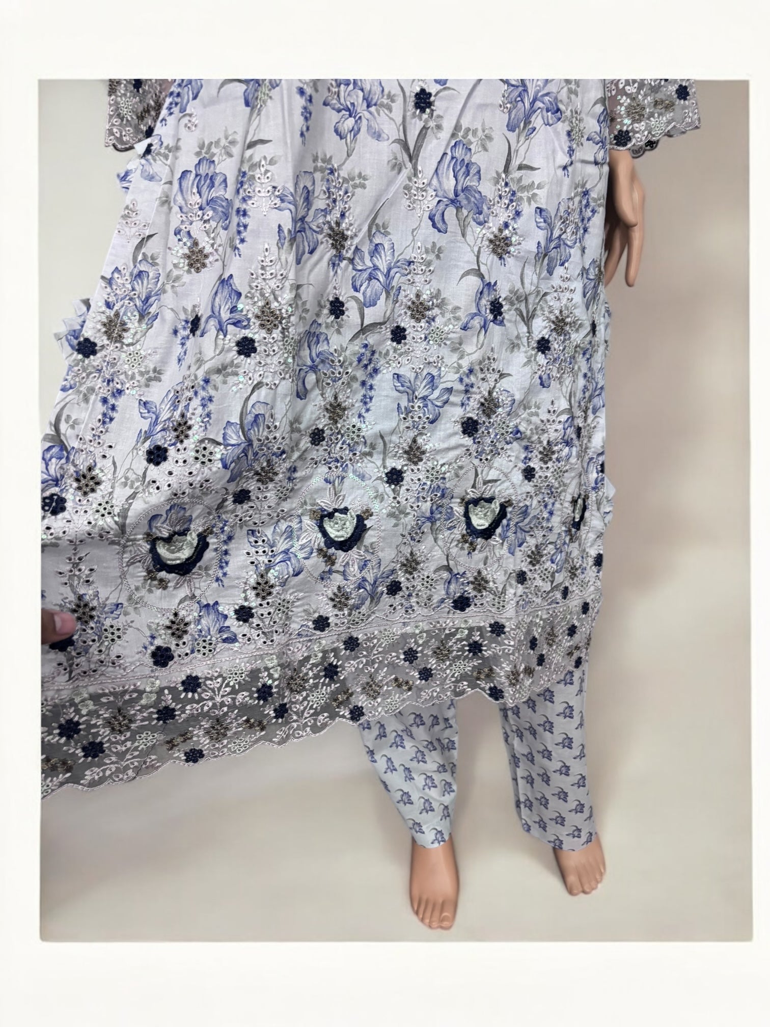 Traditional Pakistani Salwar Kameez by Saree Ghor Charlotte featuring vibrant ethnic fabric and intricate embroidery for women.