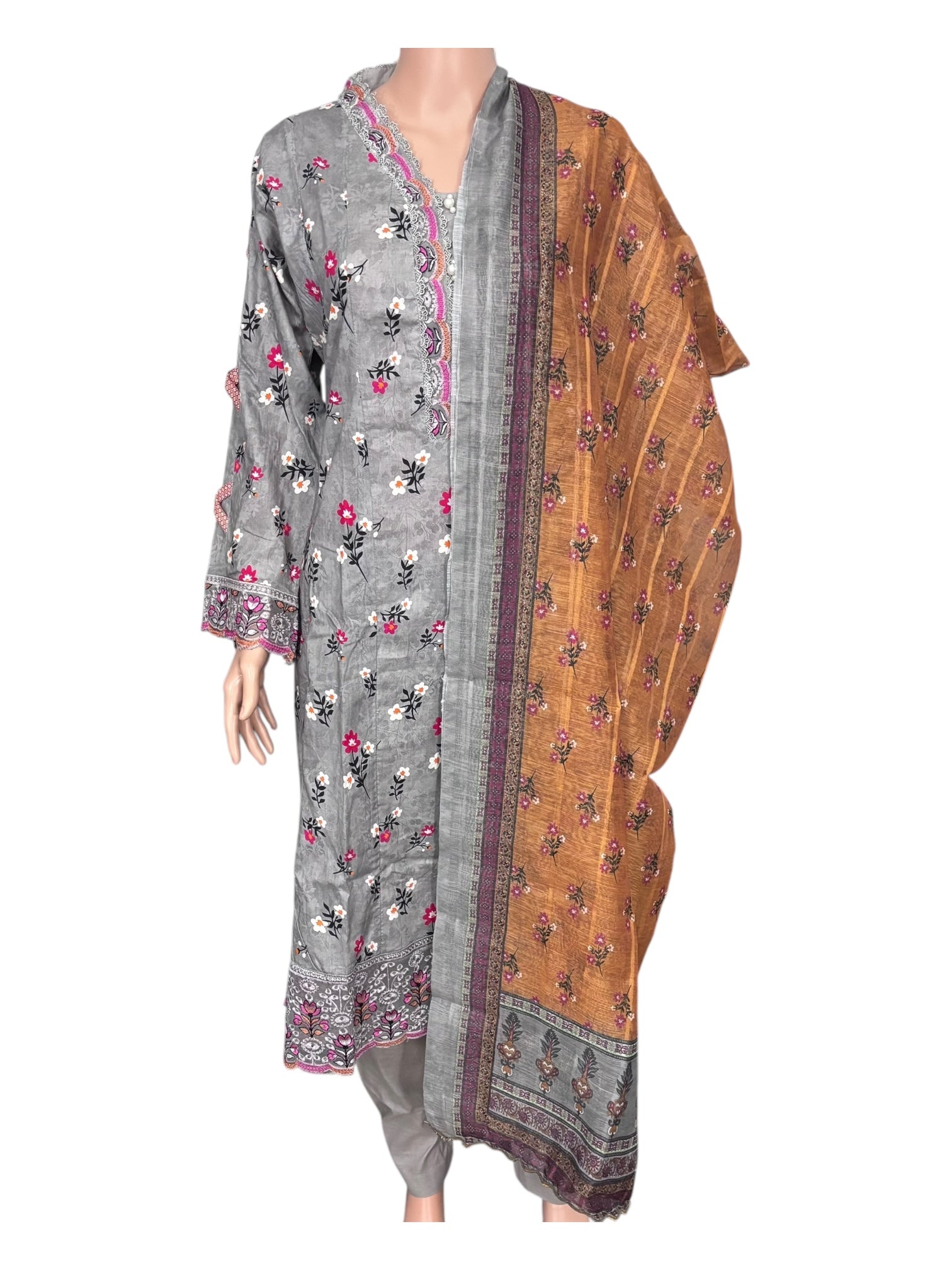 Traditional Pakistani Salwar Kameez by Saree Ghor Charlotte, ethnic wear for women with intricate embroidery and vibrant fabric.