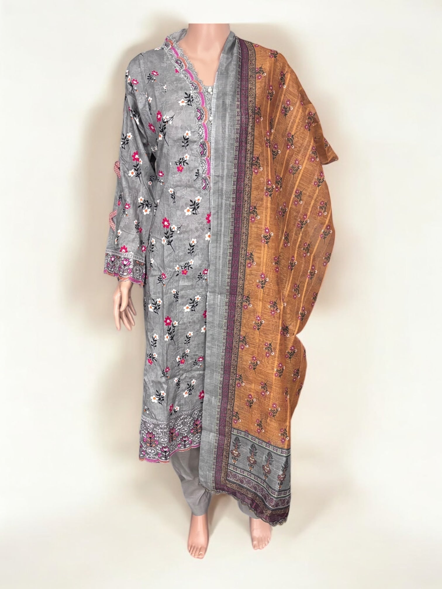 Traditional Pakistani Salwar Kameez by Saree Ghor Charlotte, featuring vibrant ethnic wear for women with intricate patterns and fabric.