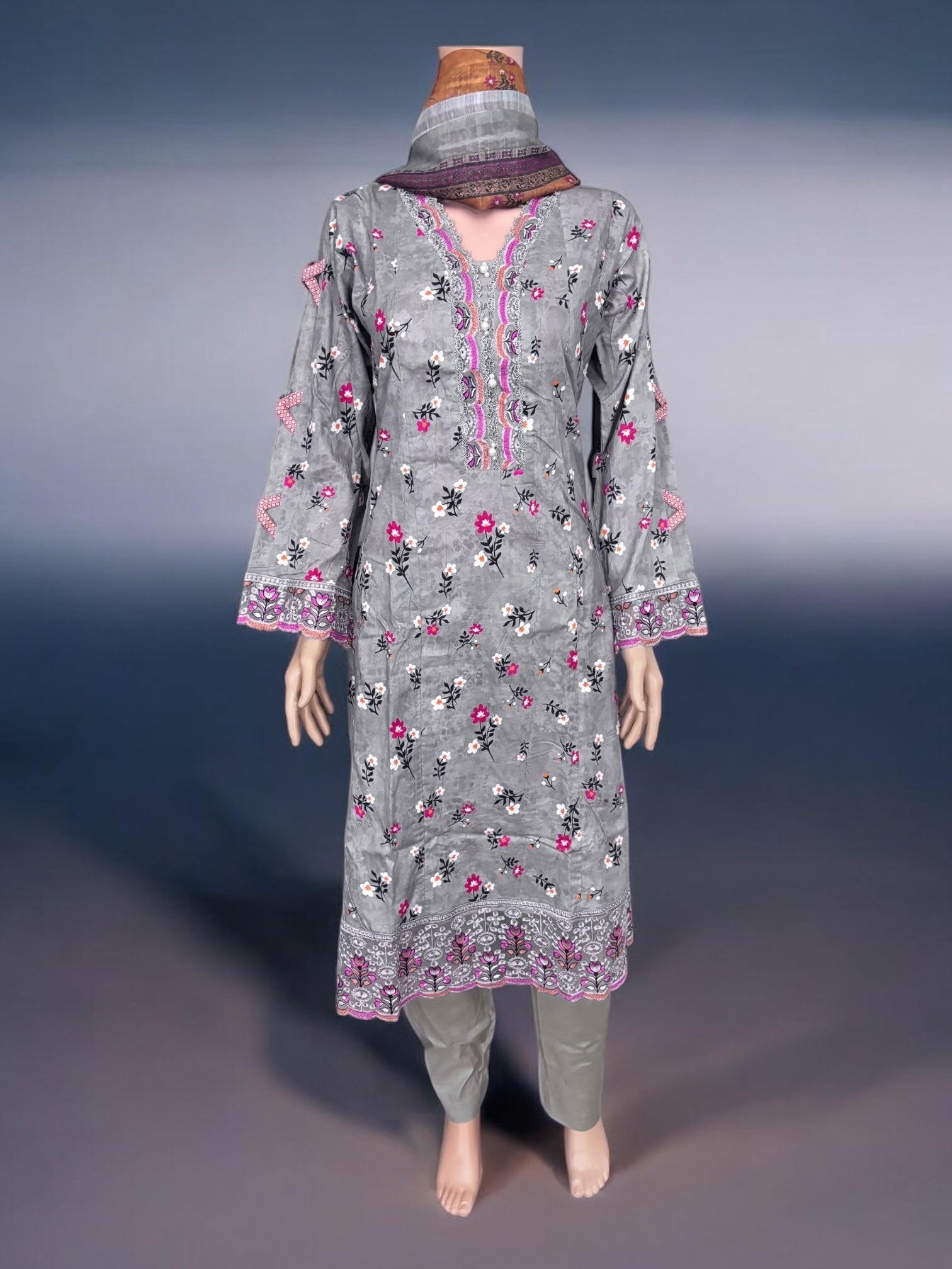 Traditional Pakistani Salwar Kameez by Saree Ghor Charlotte, featuring intricate embroidery and vibrant ethnic wear for women.