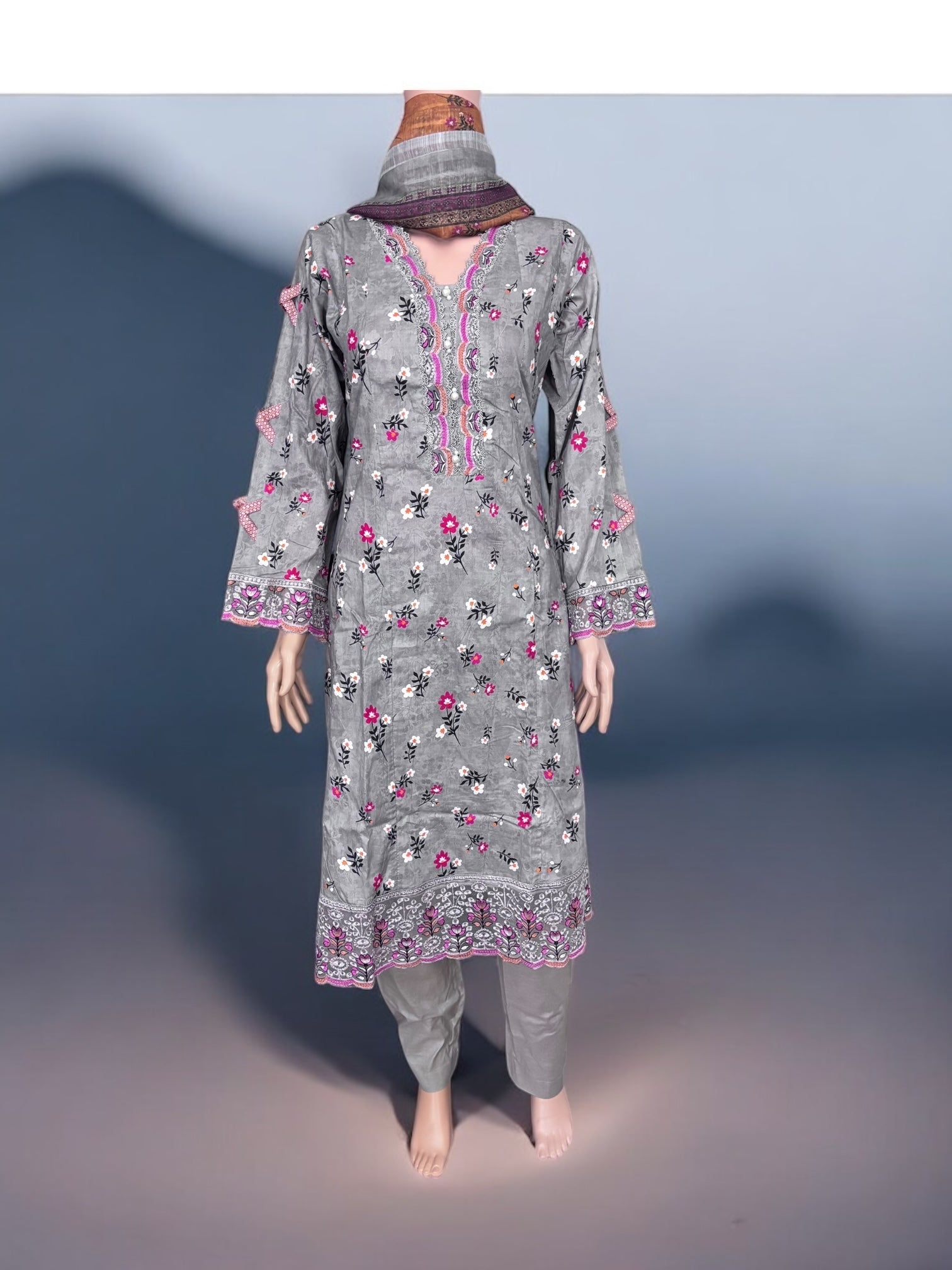 Traditional Pakistani Salwar Kameez by Saree Ghor Charlotte, showcasing vibrant ethnic wear for women with intricate patterns.