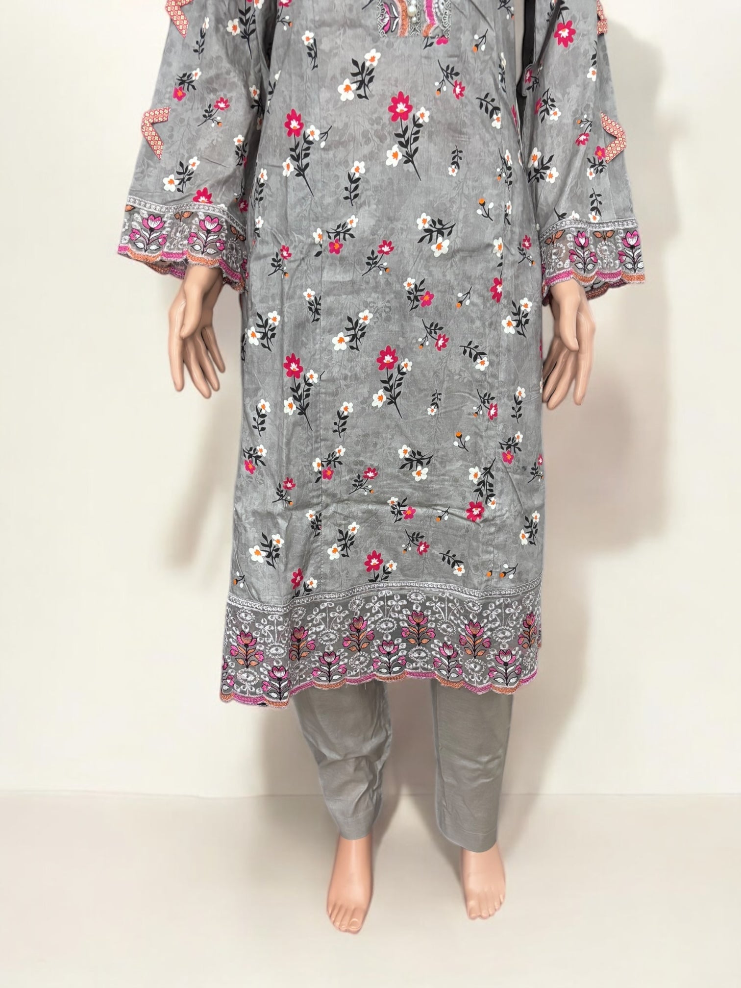 Traditional Pakistani Salwar Kameez by Saree Ghor Charlotte, featuring intricate embroidery and vibrant ethnic wear for women.