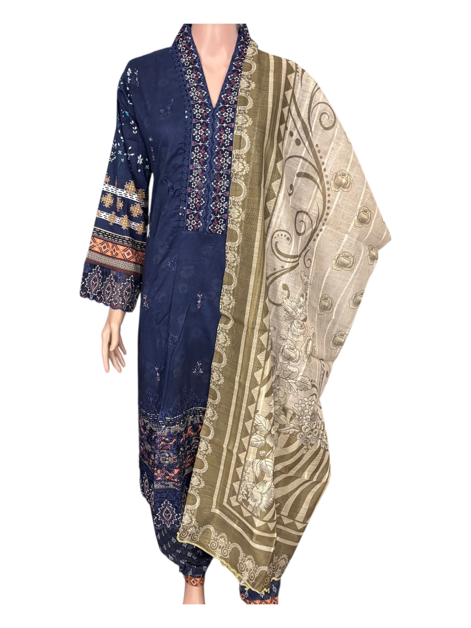 Traditional Pakistani Salwar Kameez by Saree Ghor Charlotte, featuring colorful ethnic wear for women with intricate designs.