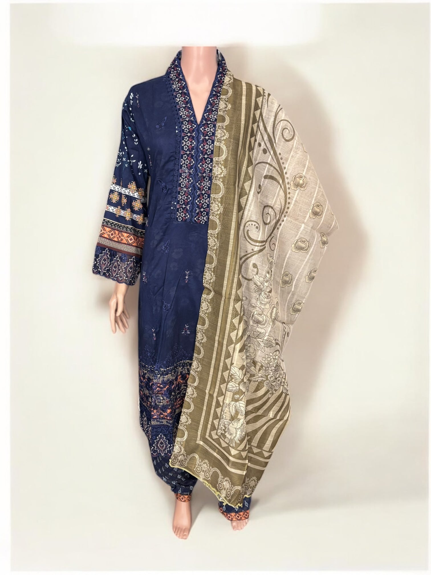 Traditional Pakistani Salwar Kameez by Saree Ghor Charlotte featuring intricate embroidery and vibrant ethnic wear for women.