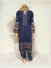 Traditional Pakistani Salwar Kameez by Saree Ghor Charlotte, elegant ethnic wear for women with intricate fabric and vibrant colors.