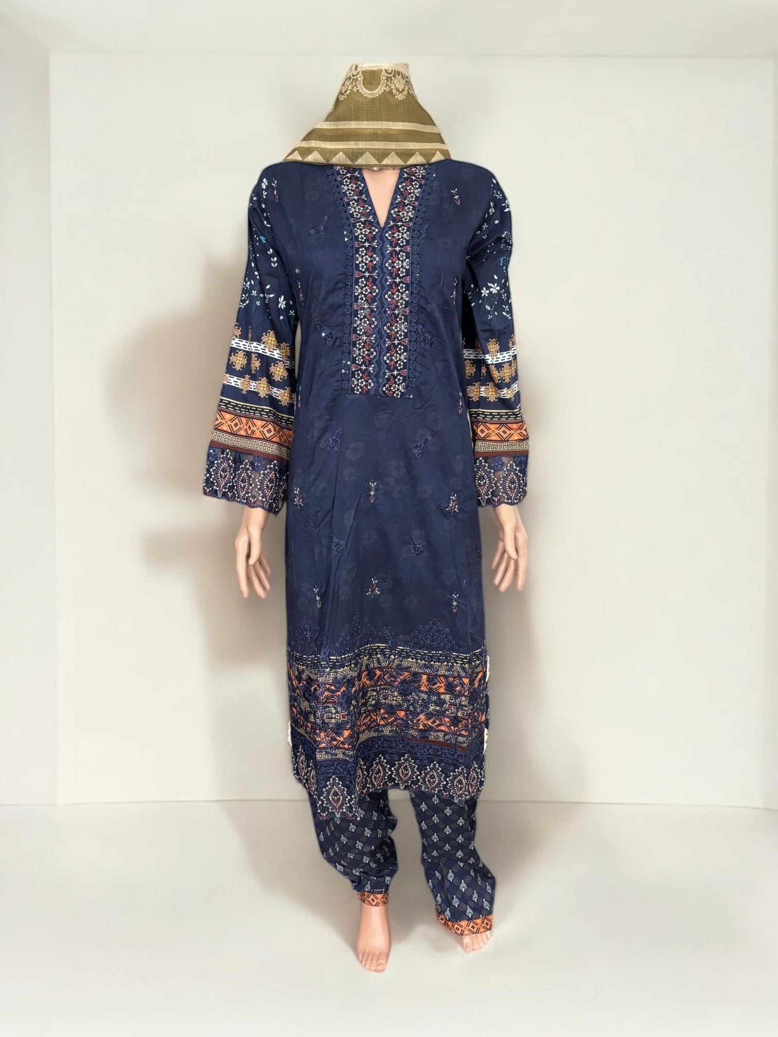 Traditional Pakistani Salwar Kameez by Saree Ghor Charlotte, elegant ethnic wear for women with intricate fabric and vibrant colors.