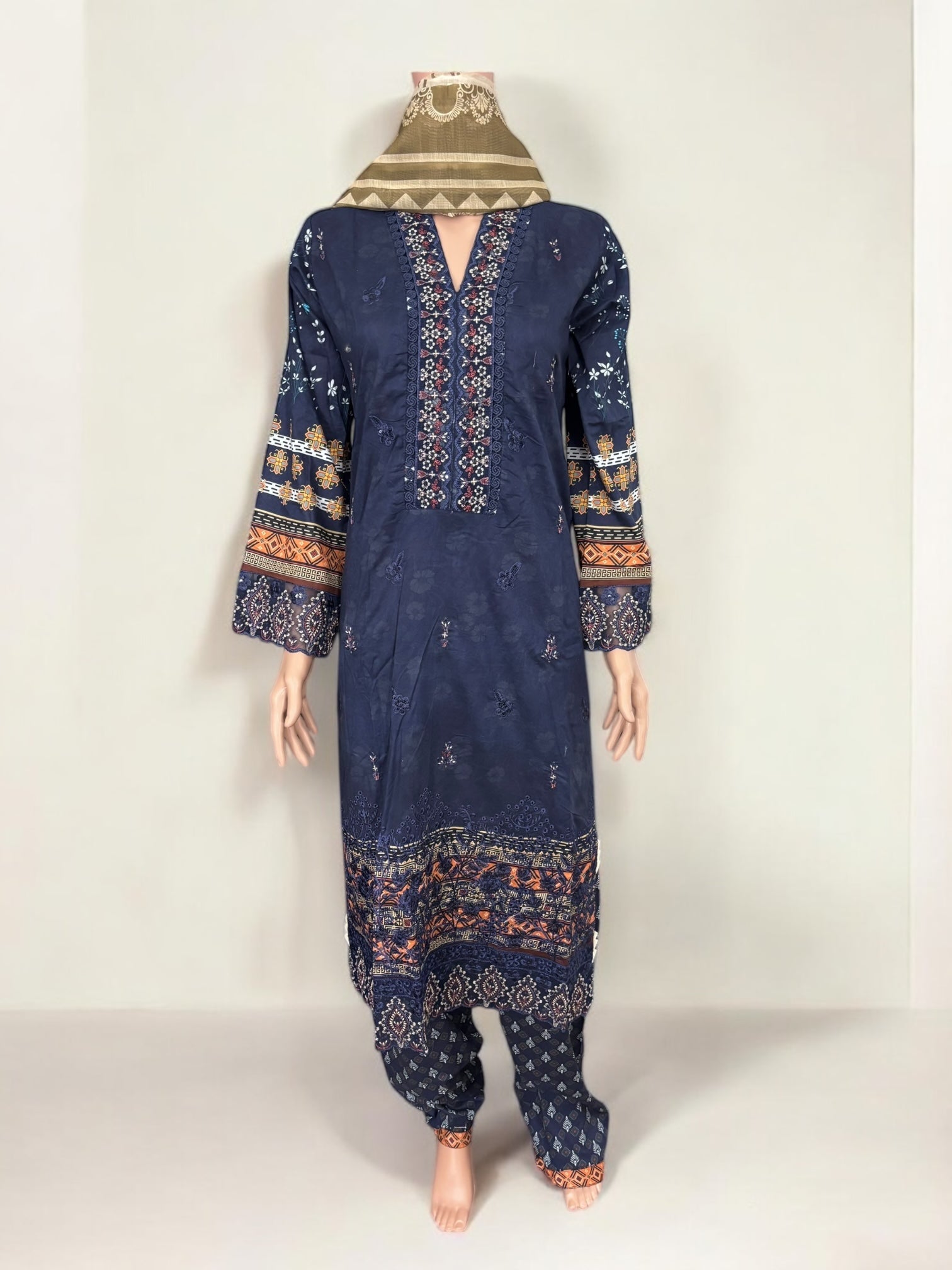 Traditional Pakistani Salwar Kameez by Saree Ghor Charlotte, ethnic wear for women with intricate embroidery and vibrant colors.