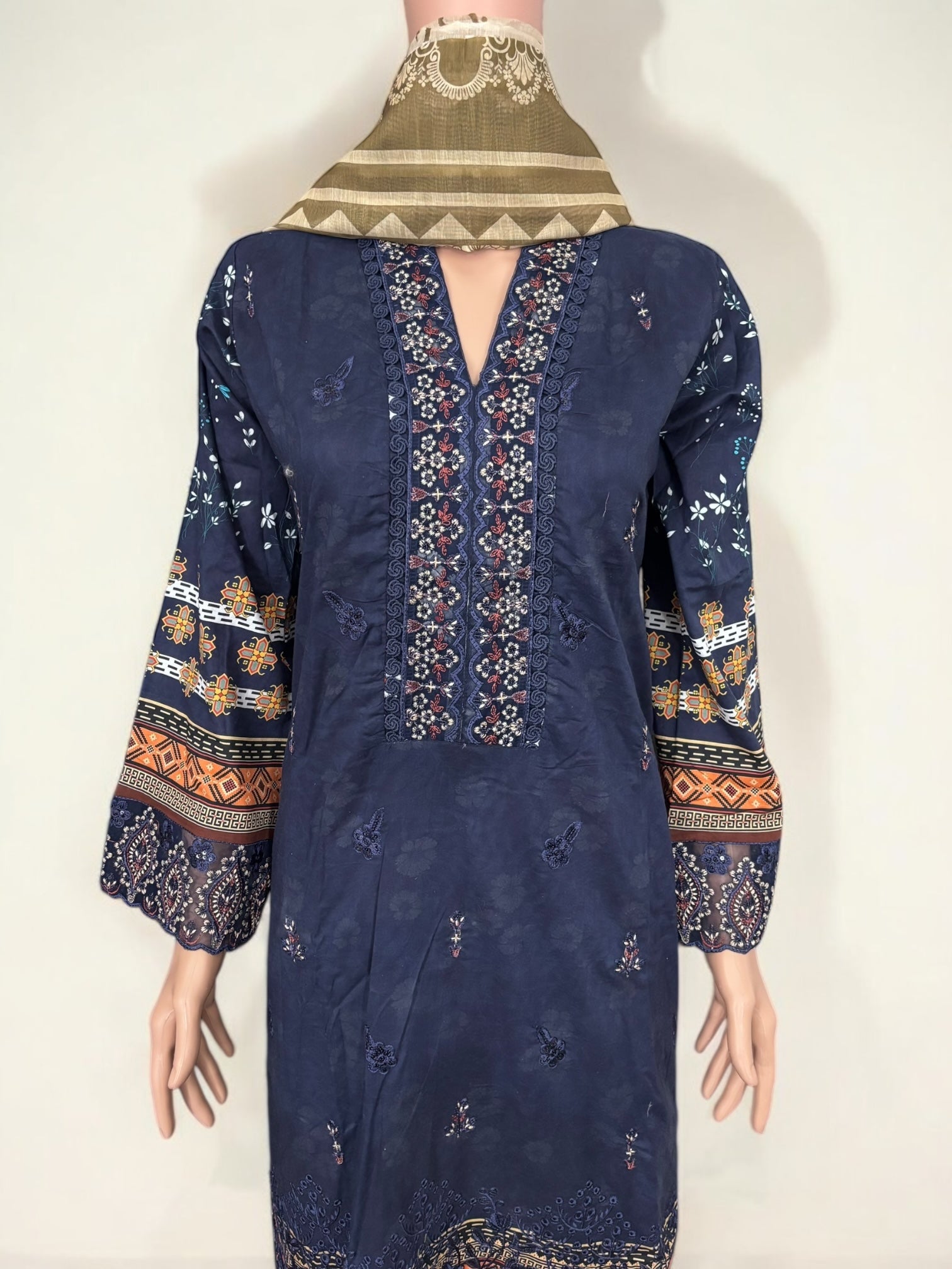 Traditional Pakistani Salwar Kameez by Saree Ghor Charlotte, featuring vibrant ethnic wear for women with intricate design details.