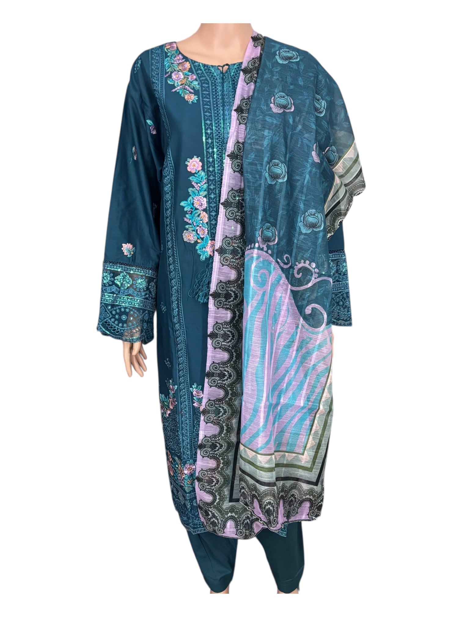 Traditional Pakistani Salwar Kameez by Saree Ghor Charlotte, elegant ethnic wear for women with intricate fabric and vibrant colors.