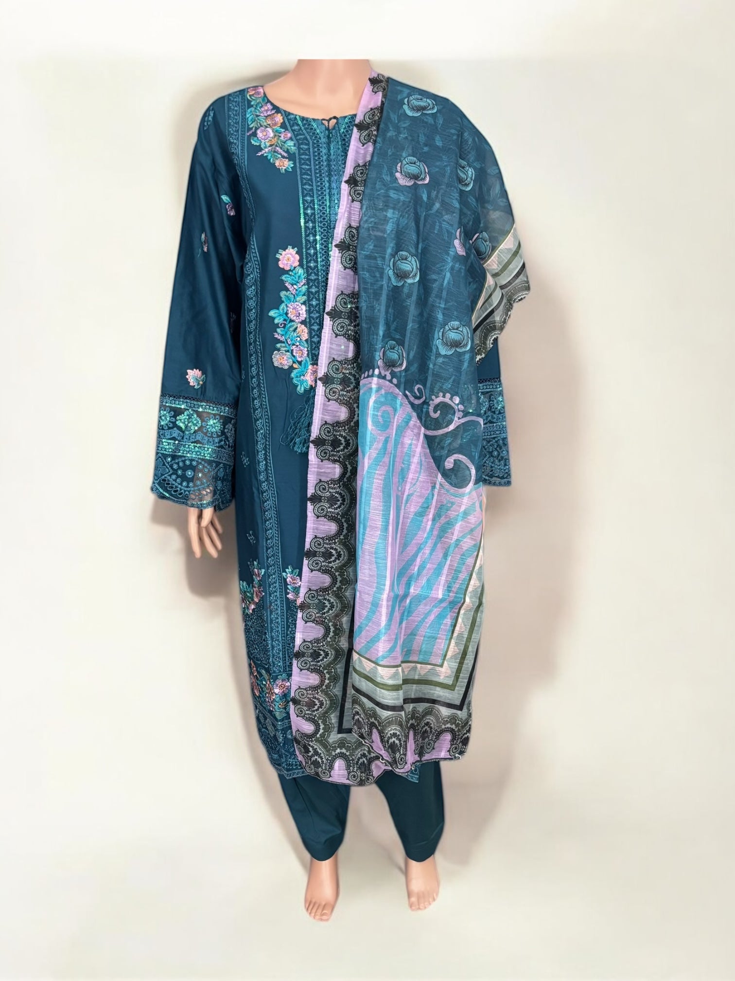 Traditional Pakistani Salwar Kameez by Saree Ghor Charlotte, showcasing intricate embroidery and vibrant ethnic wear for women.