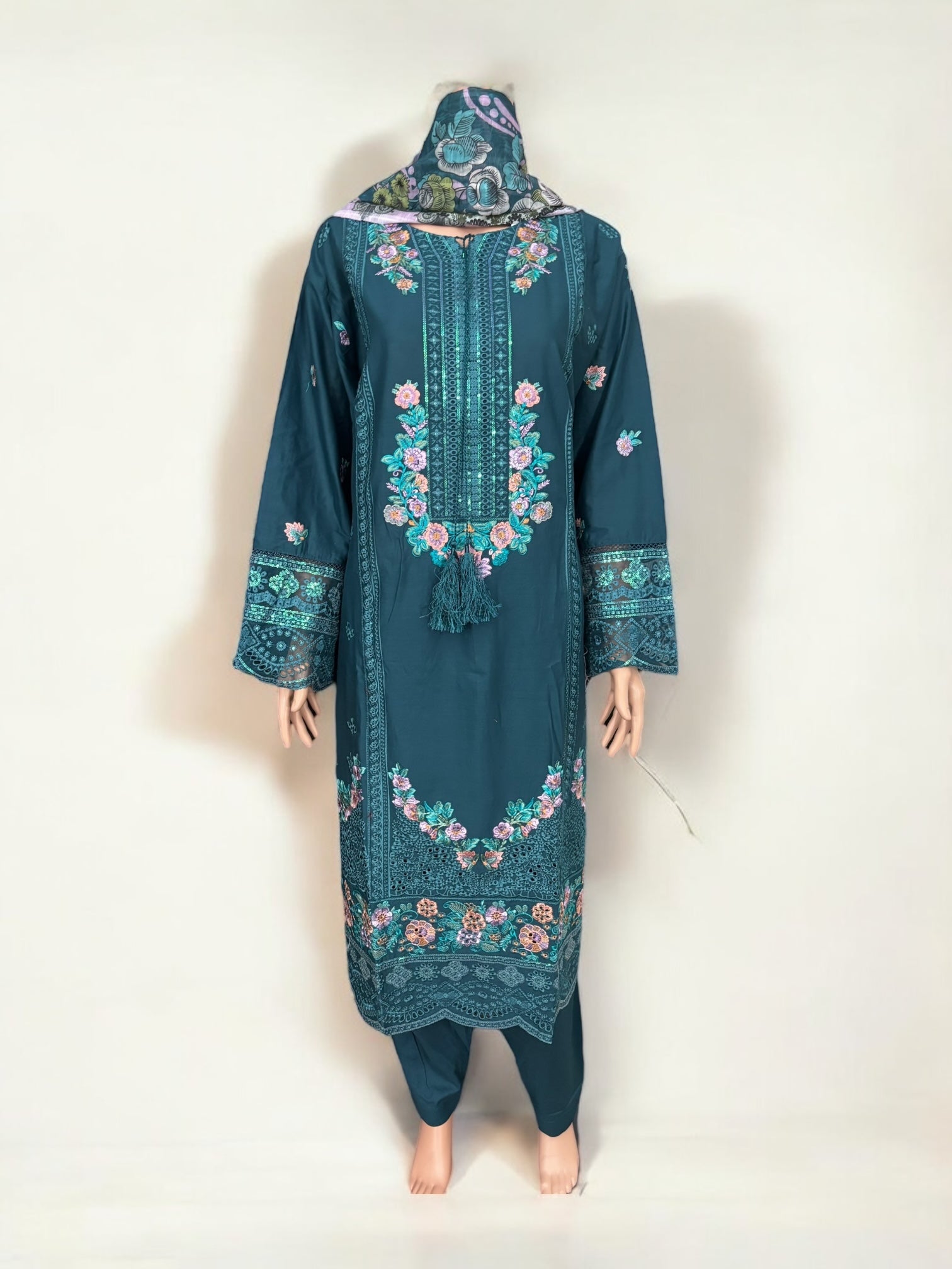 Traditional Pakistani Salwar Kameez by Saree Ghor Charlotte, featuring vibrant ethnic wear with intricate embroidery for women.
