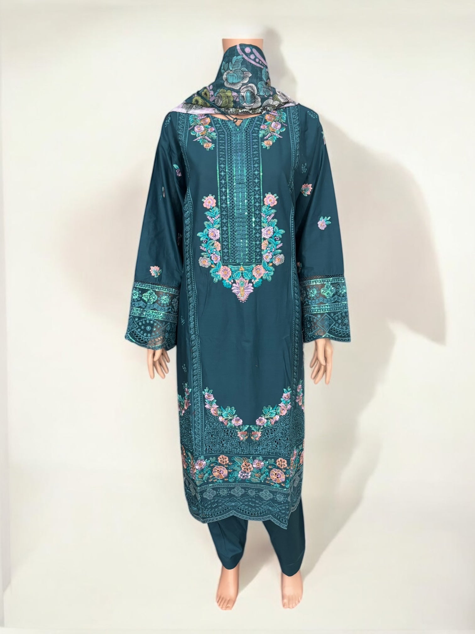 Traditional Pakistani Salwar Kameez by Saree Ghor Charlotte, showcasing vibrant ethnic wear for women with intricate fabric and detailing.