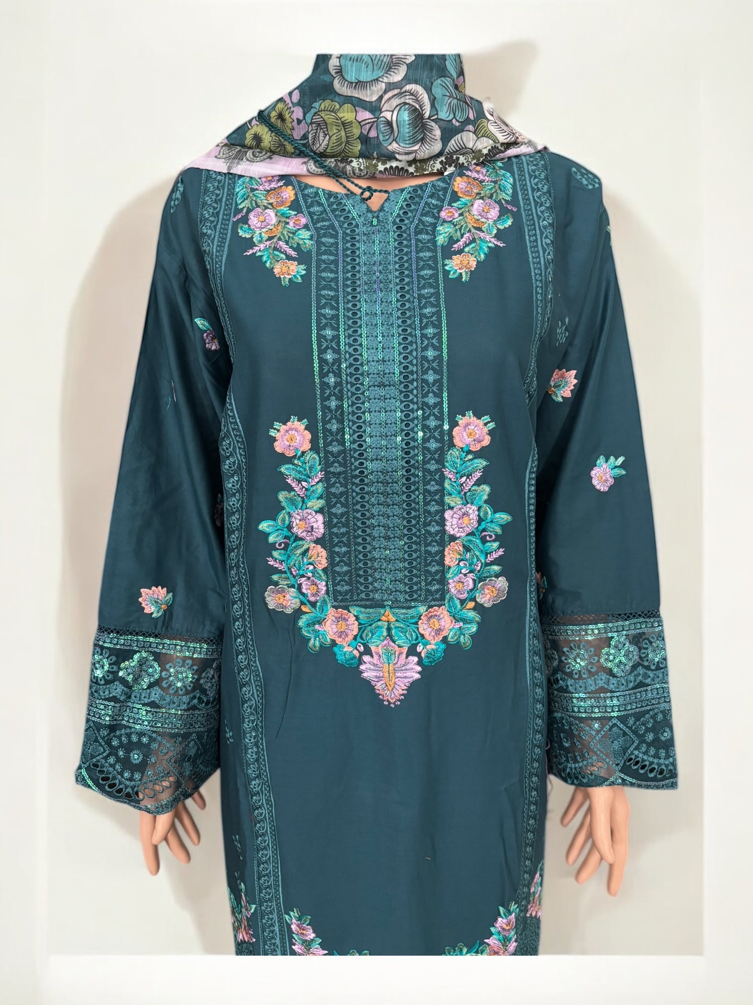 Traditional Pakistani Salwar Kameez by Saree Ghor Charlotte, elegant ethnic wear for women with intricate patterns and vibrant colors.