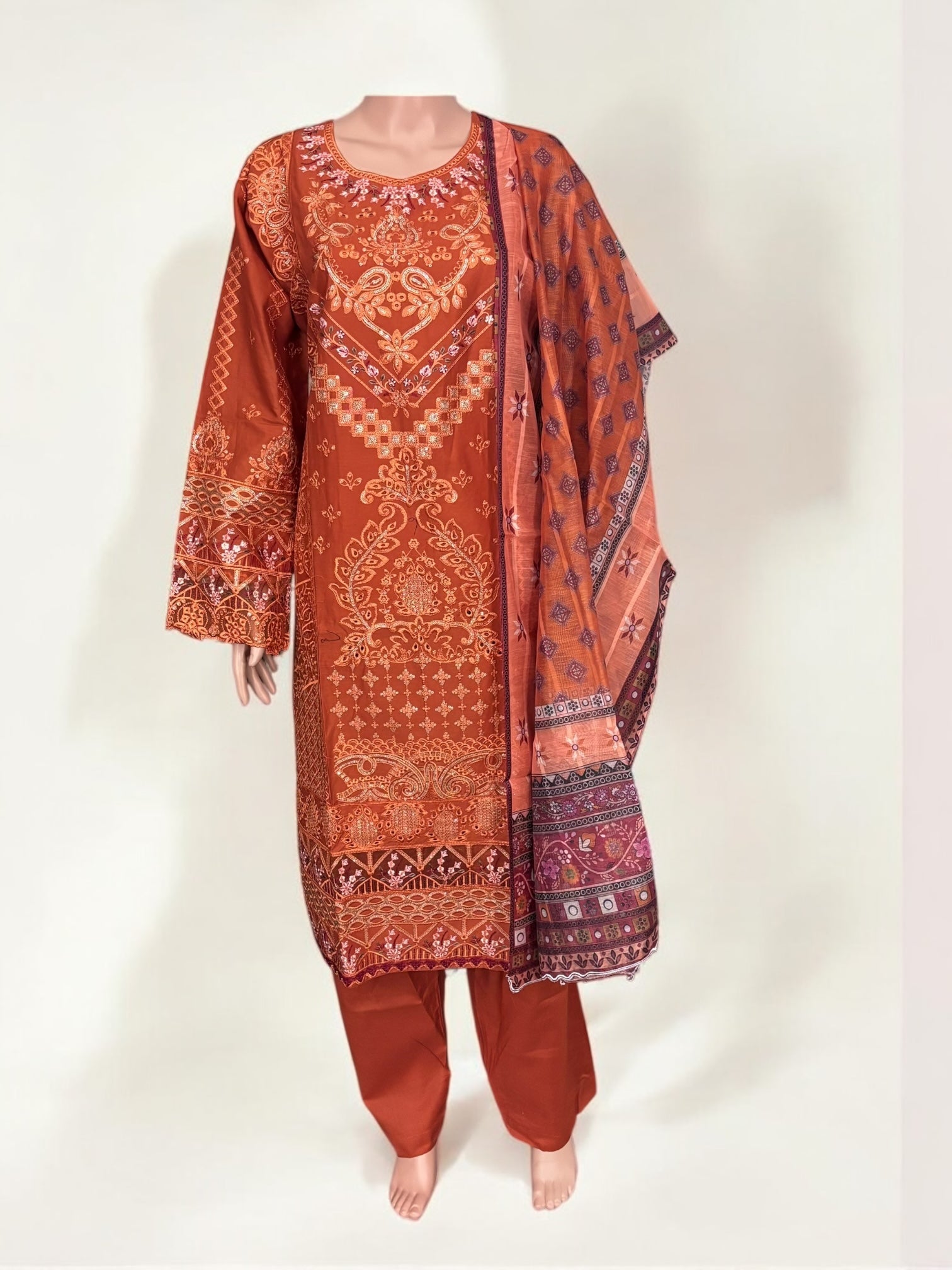 Traditional Pakistani Salwar Kameez by Saree Ghor Charlotte, featuring intricate embroidery and vibrant ethnic wear for women.