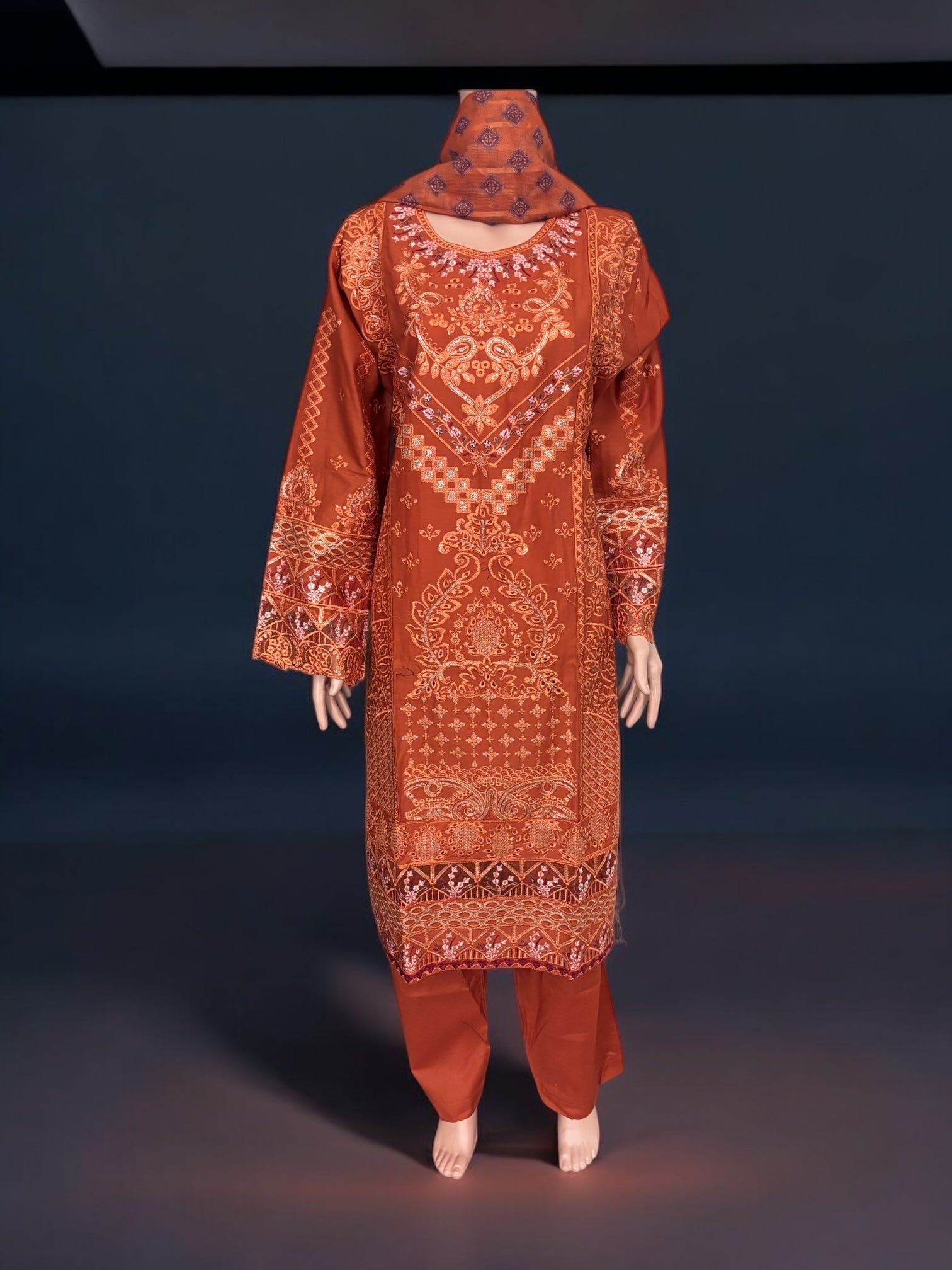 Traditional Pakistani Salwar Kameez by Saree Ghor Charlotte featuring intricate embroidery and vibrant ethnic design for women.