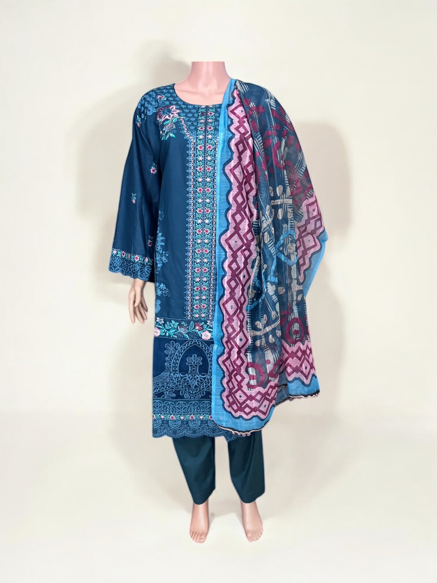 Traditional Pakistani Salwar Kameez by Saree Ghor Charlotte, showcasing intricate embroidery and vibrant ethnic wear for women.