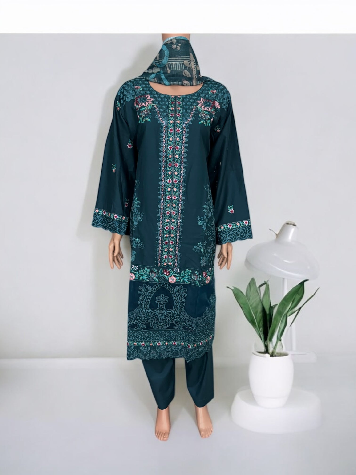 Traditional Pakistani Salwar Kameez by Saree Ghor Charlotte, featuring vibrant ethnic wear for women with intricate embroidery.
