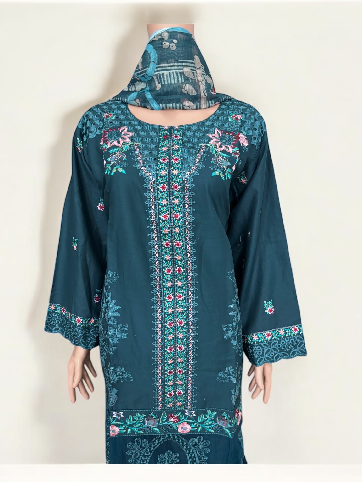 Traditional Pakistani Salwar Kameez by Saree Ghor Charlotte, showcasing vibrant ethnic wear for women with intricate detailing.