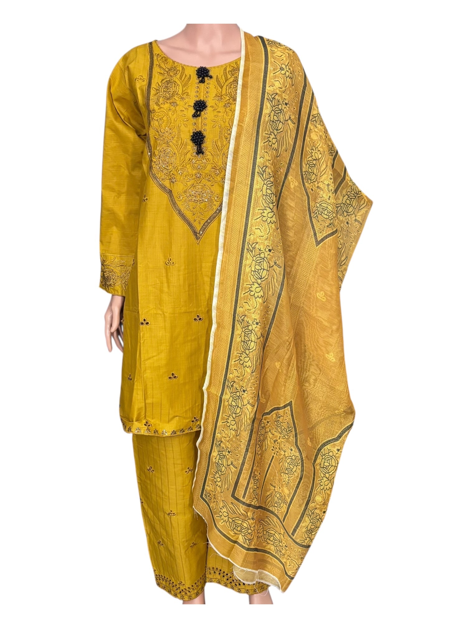 Traditional Pakistani Salwar Kameez by Saree Ghor Charlotte, featuring intricate ethnic embroidery and vibrant fabric for women.