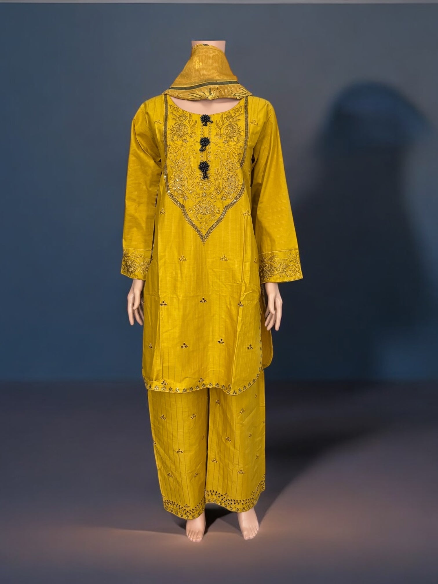 Traditional Pakistani Salwar Kameez by Saree Ghor Charlotte, showcasing vibrant ethnic wear for women with intricate details.