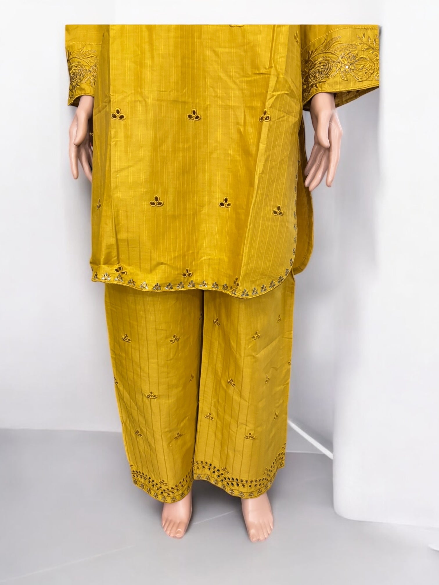 Traditional Pakistani Salwar Kameez by Saree Ghor Charlotte, elegant ethnic wear for women with intricate embroidery and vibrant colors.