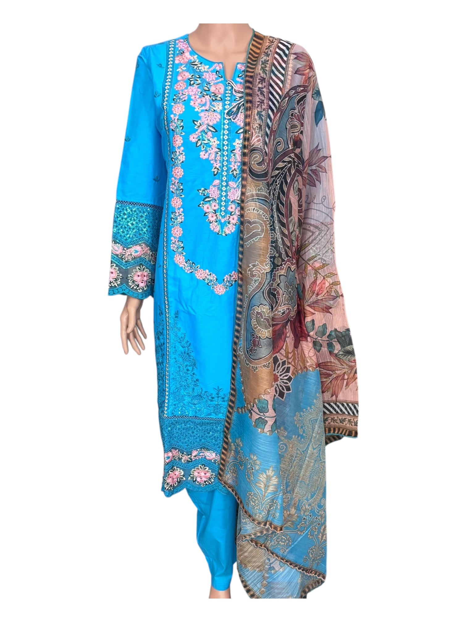Traditional Pakistani Salwar Kameez by Saree Ghor Charlotte featuring intricate embroidery and vibrant ethnic wear for women.