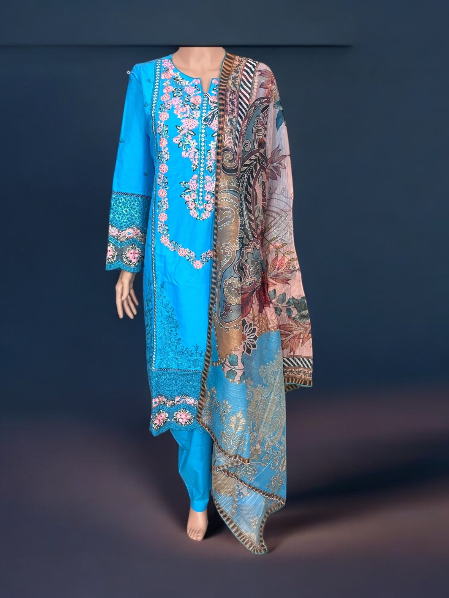 Traditional Pakistani Salwar Kameez by Saree Ghor Charlotte, showcasing vibrant ethnic wear for women with detailed embroidery.