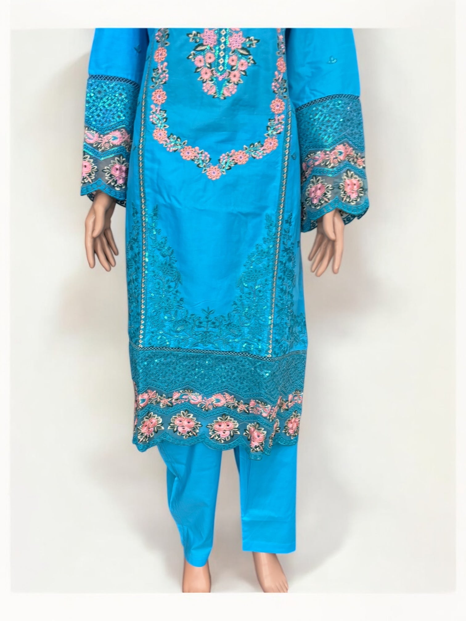 Traditional Pakistani Salwar Kameez by Saree Ghor Charlotte, ethnic wear for women, detailed fabric and vibrant design.