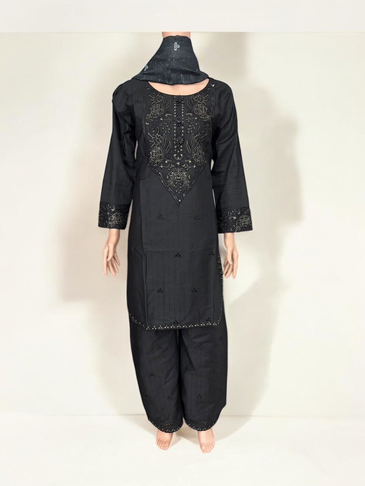 Traditional Pakistani Salwar Kameez by Saree Ghor Charlotte featuring intricate embroidery and vibrant ethnic wear for women.