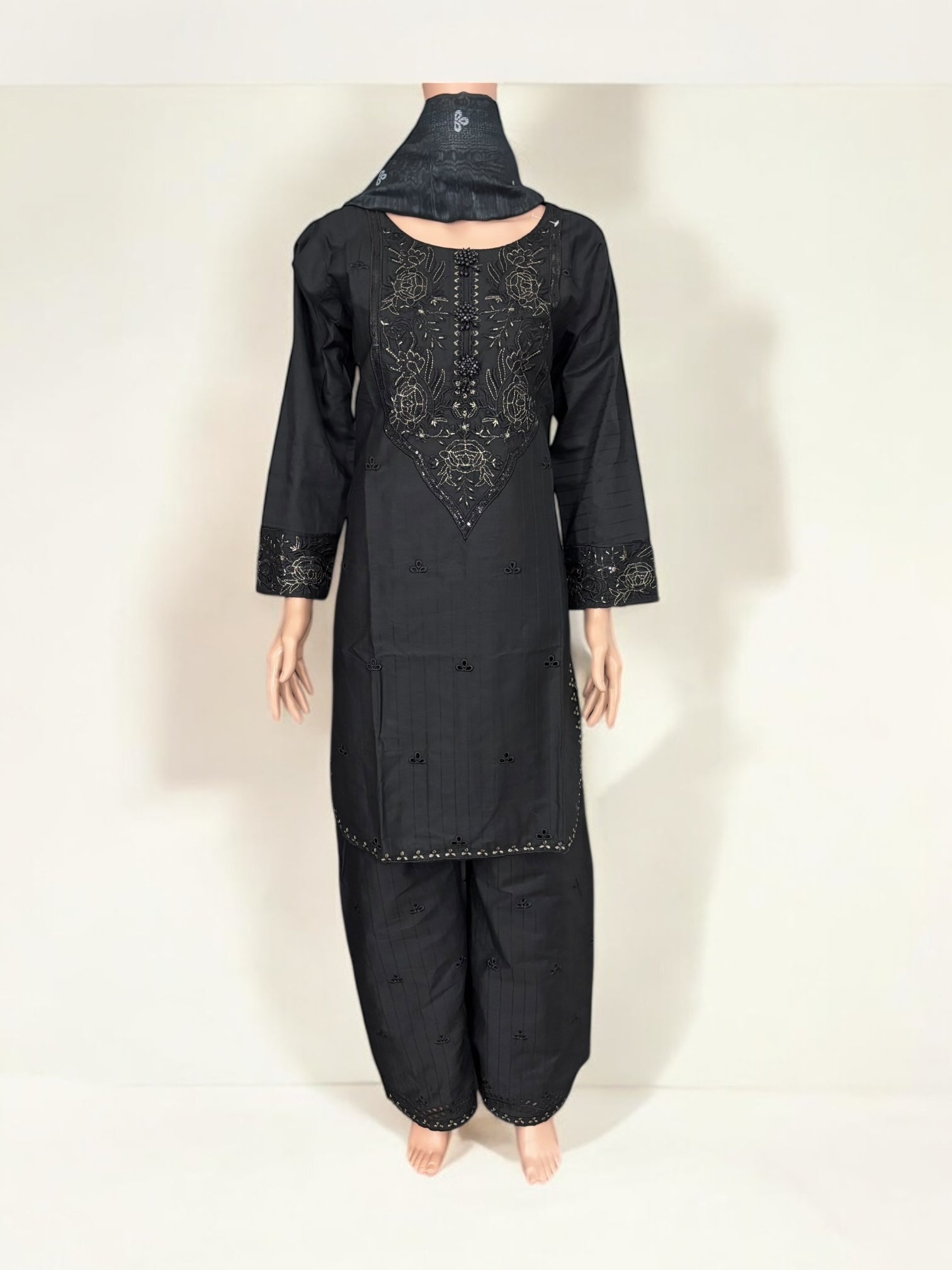 Traditional Pakistani Salwar Kameez by Saree Ghor Charlotte, elegant ethnic wear for women with intricate embroidery and vibrant colors.